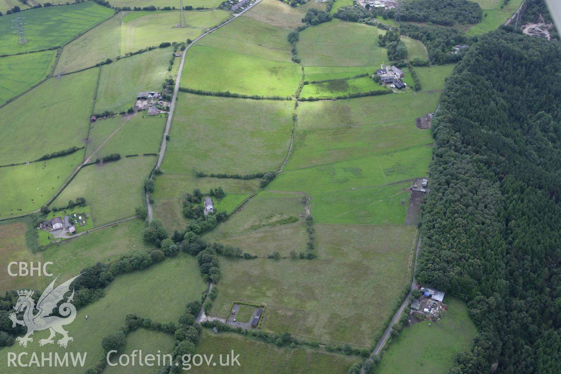 RCAHMW colour oblique aerial photograph of Ffridd Roman Mining Settlement. Taken on 24 July 2007 by Toby Driver