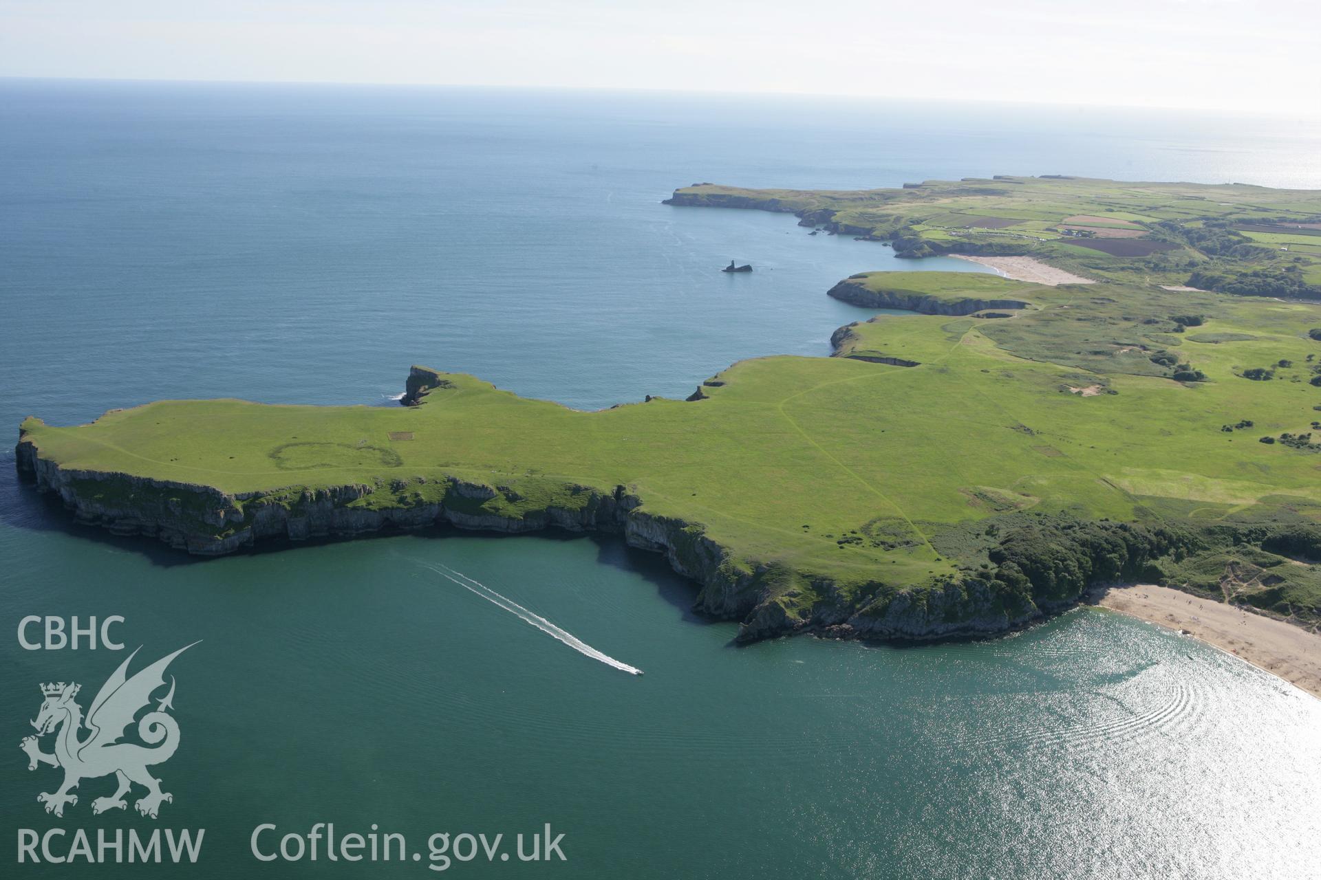 RCAHMW colour oblique aerial photograph of Mowingword Promontory Enclosure, on Stackpole Head, viewed from the north. Taken on 30 July 2007 by Toby Driver