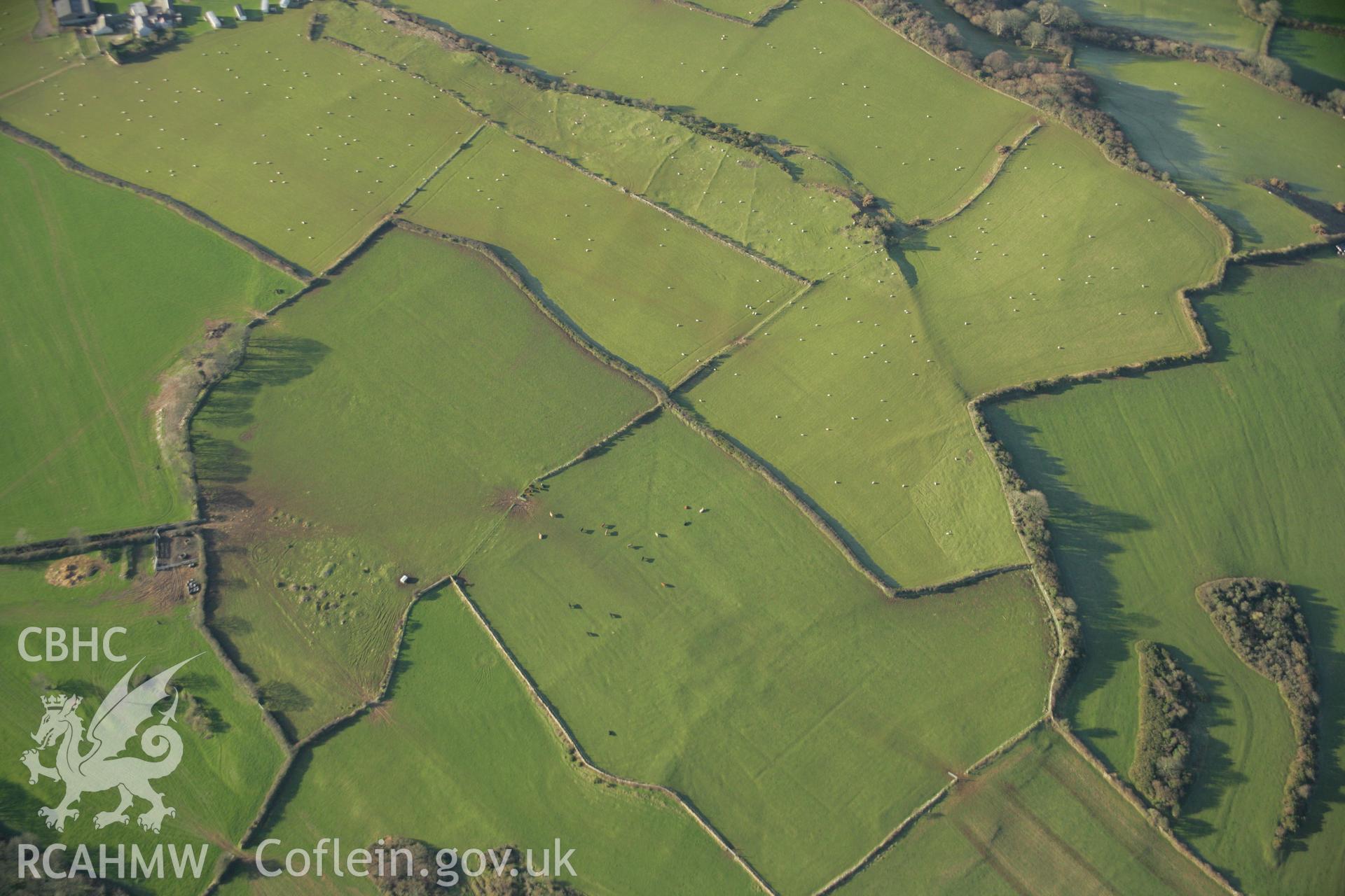 RCAHMW colour oblique aerial photograph of the Viking settlement at Glyn, Llanbedrgoch. Taken on 25 January 2007 by Toby Driver