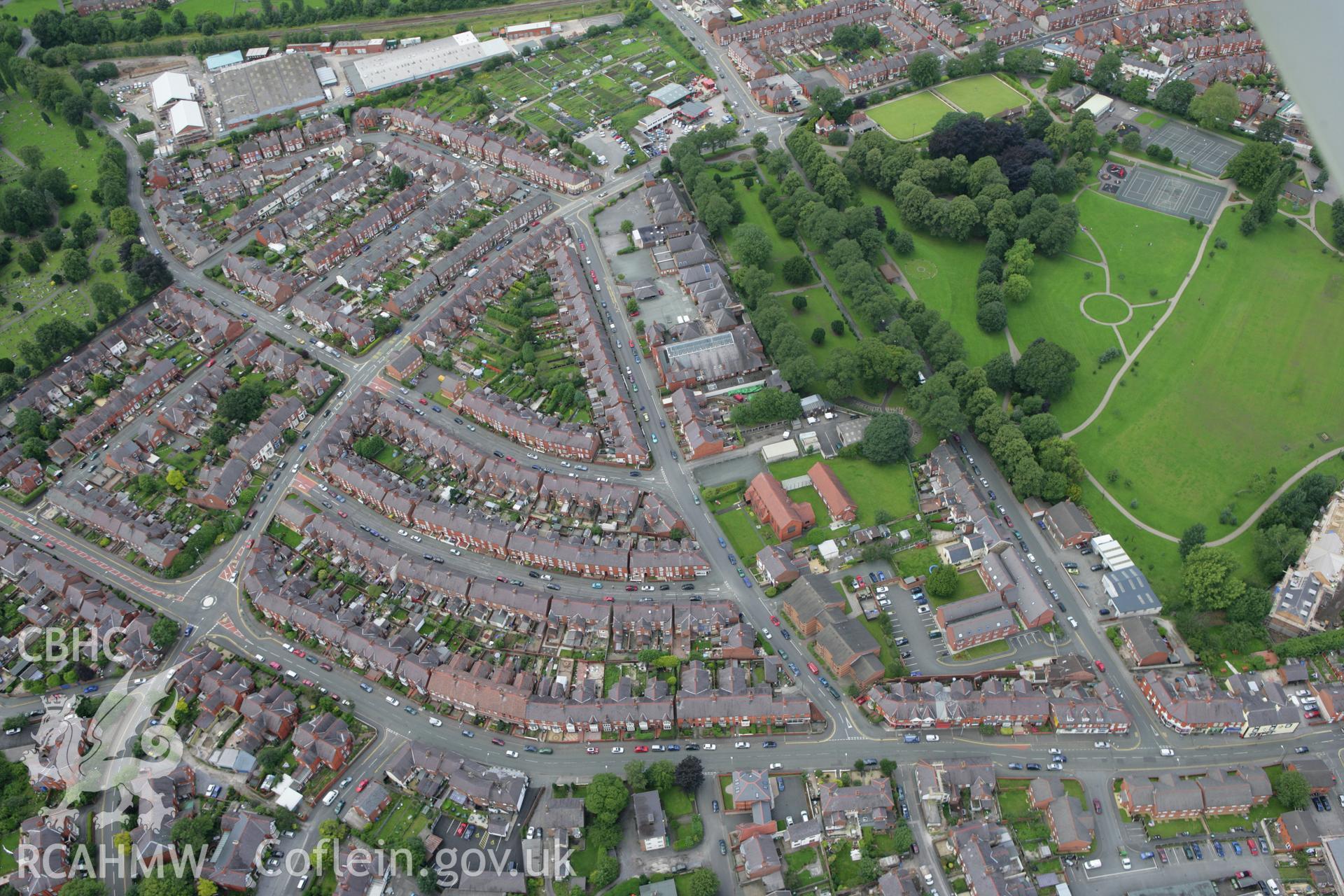 RCAHMW colour oblique aerial photograph of Wrexham showing housing in the southern part of the town. Taken on 24 July 2007 by Toby Driver