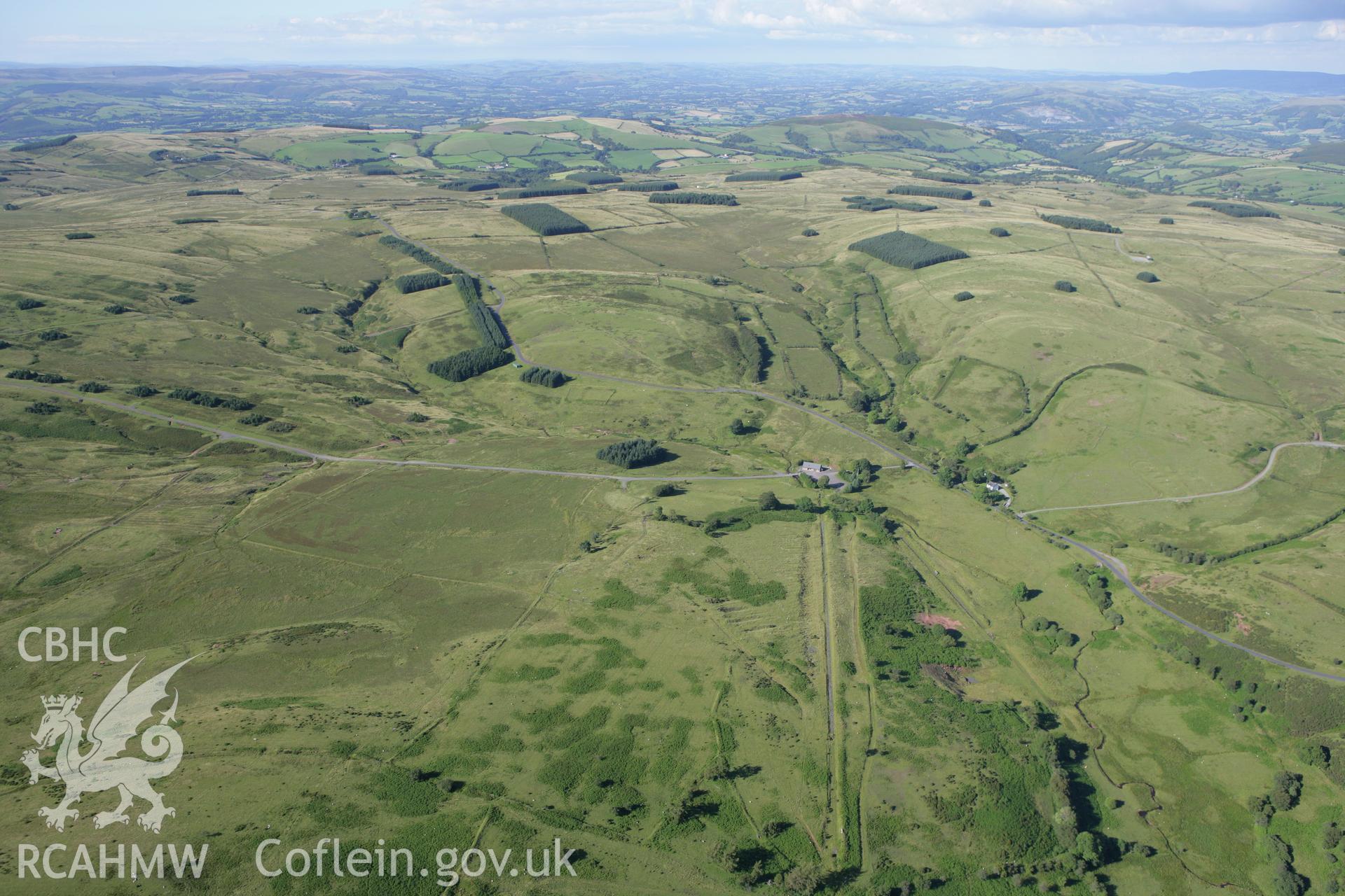 RCAHMW colour oblique aerial photograph of Disgwylfa Farmstead with redundant track targets. Taken on 08 August 2007 by Toby Driver