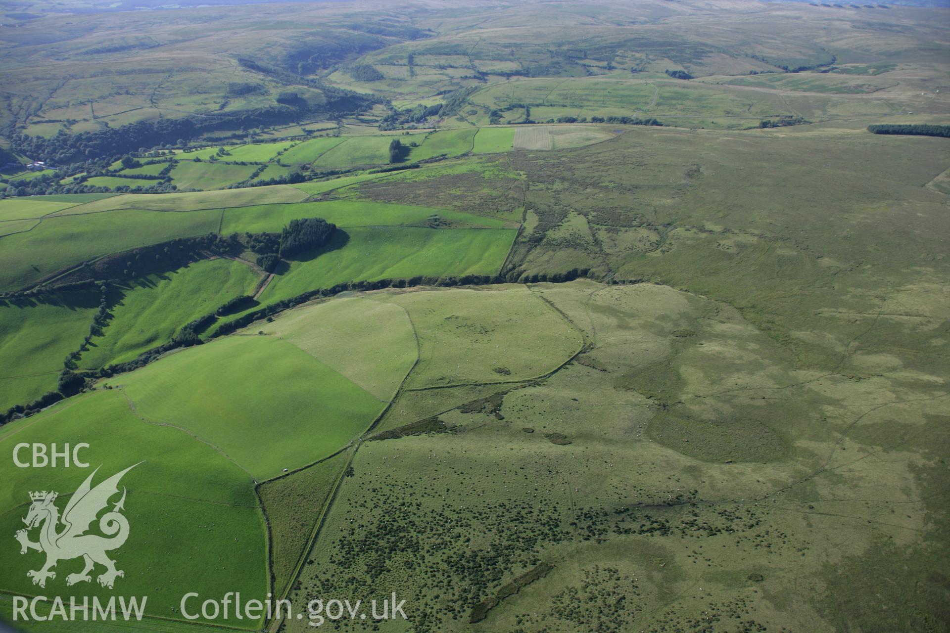 RCAHMW colour oblique aerial photograph of landscape near Garreg Fawr. Taken on 08 August 2007 by Toby Driver