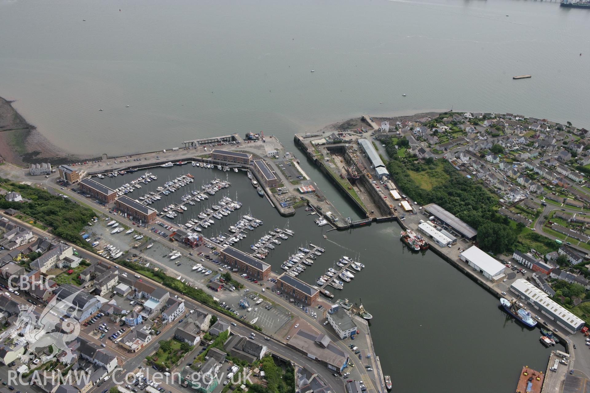 RCAHMW colour oblique photograph of Milford Haven Dockyard. Taken by Toby Driver on 01/08/2007.