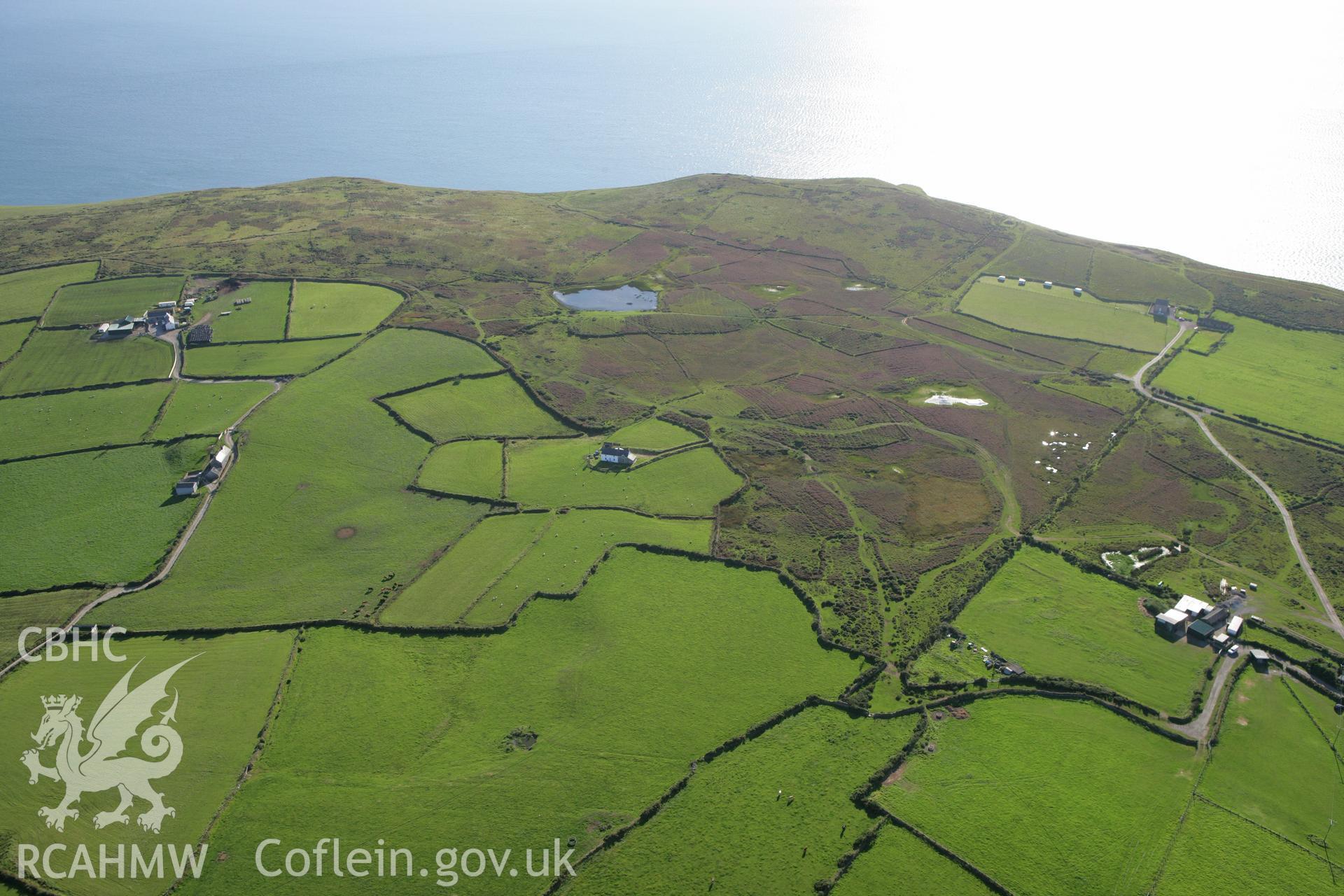 RCAHMW colour oblique aerial photograph showing landscape of Mynydd Gilan Strip Fields. Taken on 06 September 2007 by Toby Driver