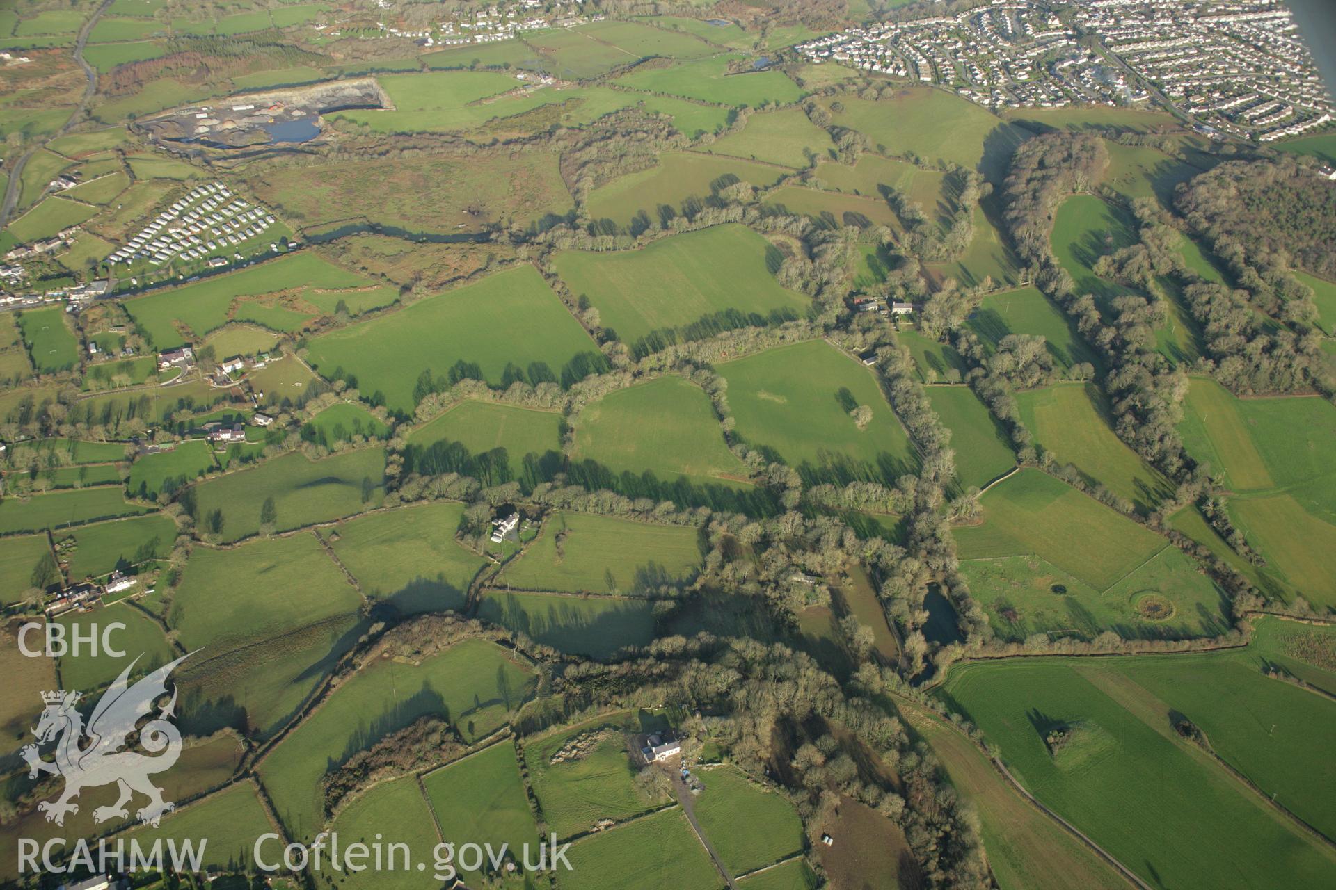 RCAHMW colour oblique aerial photograph of the Viking settlement at Glyn, Llanbedrgoch, and the surrounding landscape. Taken on 25 January 2007 by Toby Driver