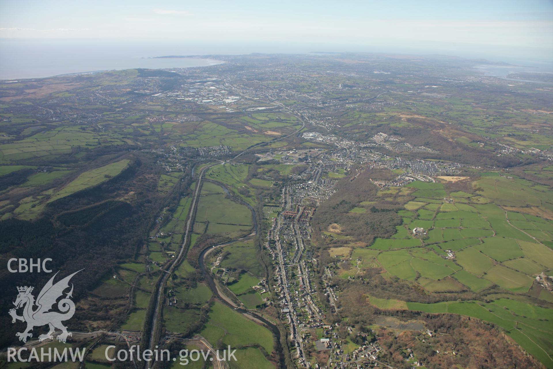 RCAHMW colour oblique aerial photograph of St Michael and All Saints' Church, Swansea Road, Trebanos in high view from the north-east. Taken on 21 March 2007 by Toby Driver