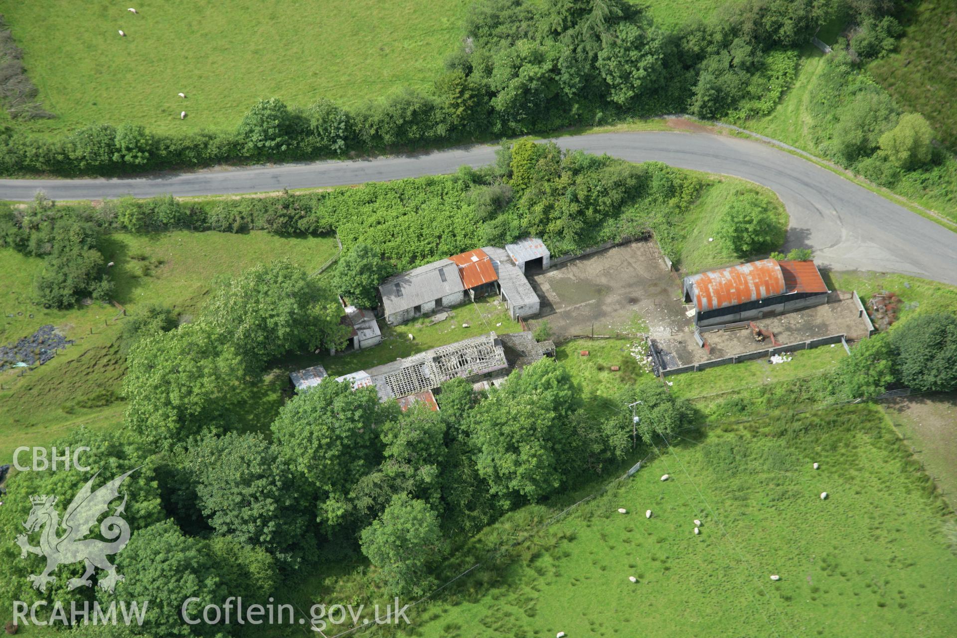 RCAHMW colour oblique aerial photograph of Spite Inn, showing the building prior to demolition. Taken on 09 July 2007 by Toby Driver