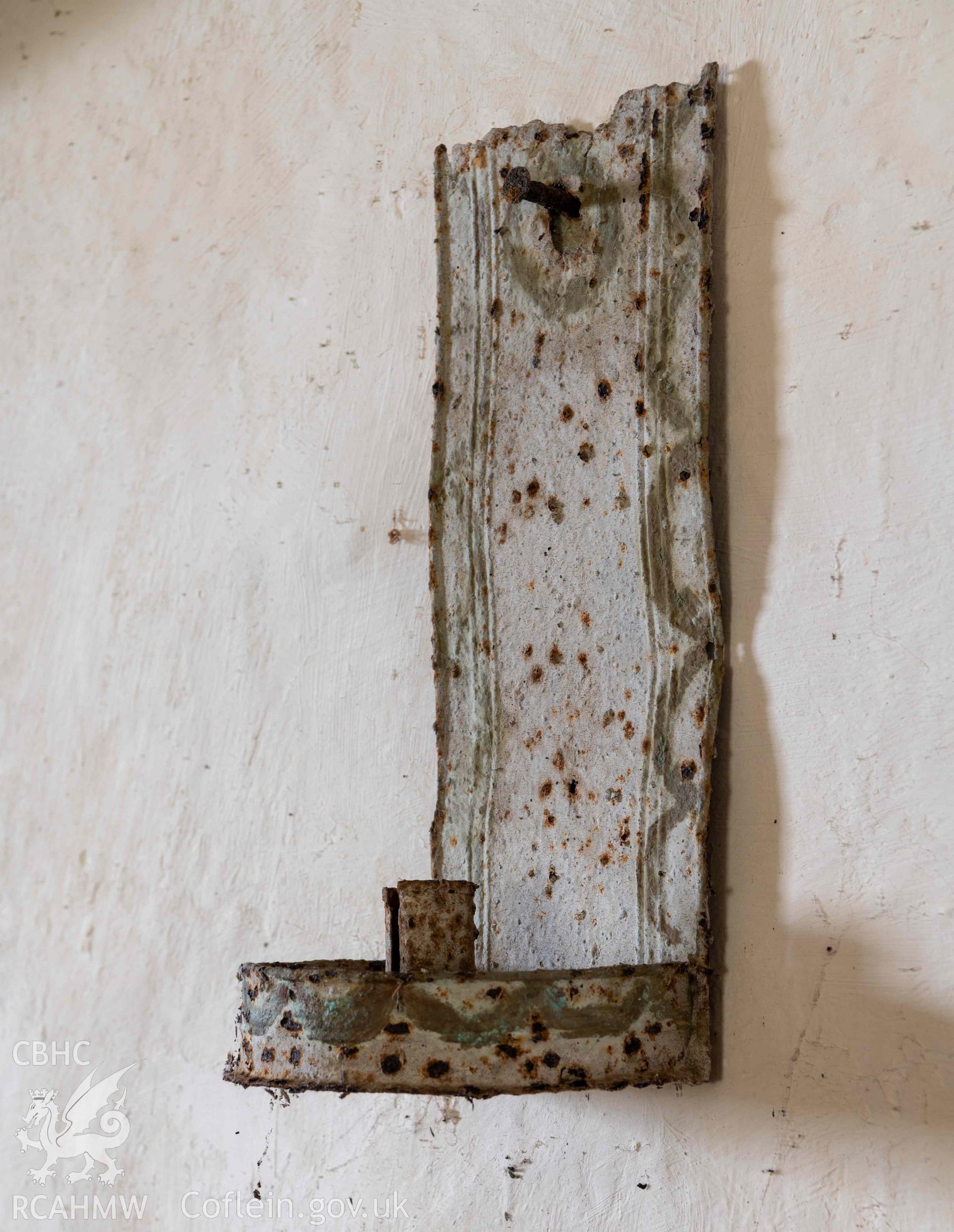 Capel Newydd - Detailed side angle view of a wall-mounted candle holder, taken from South-East