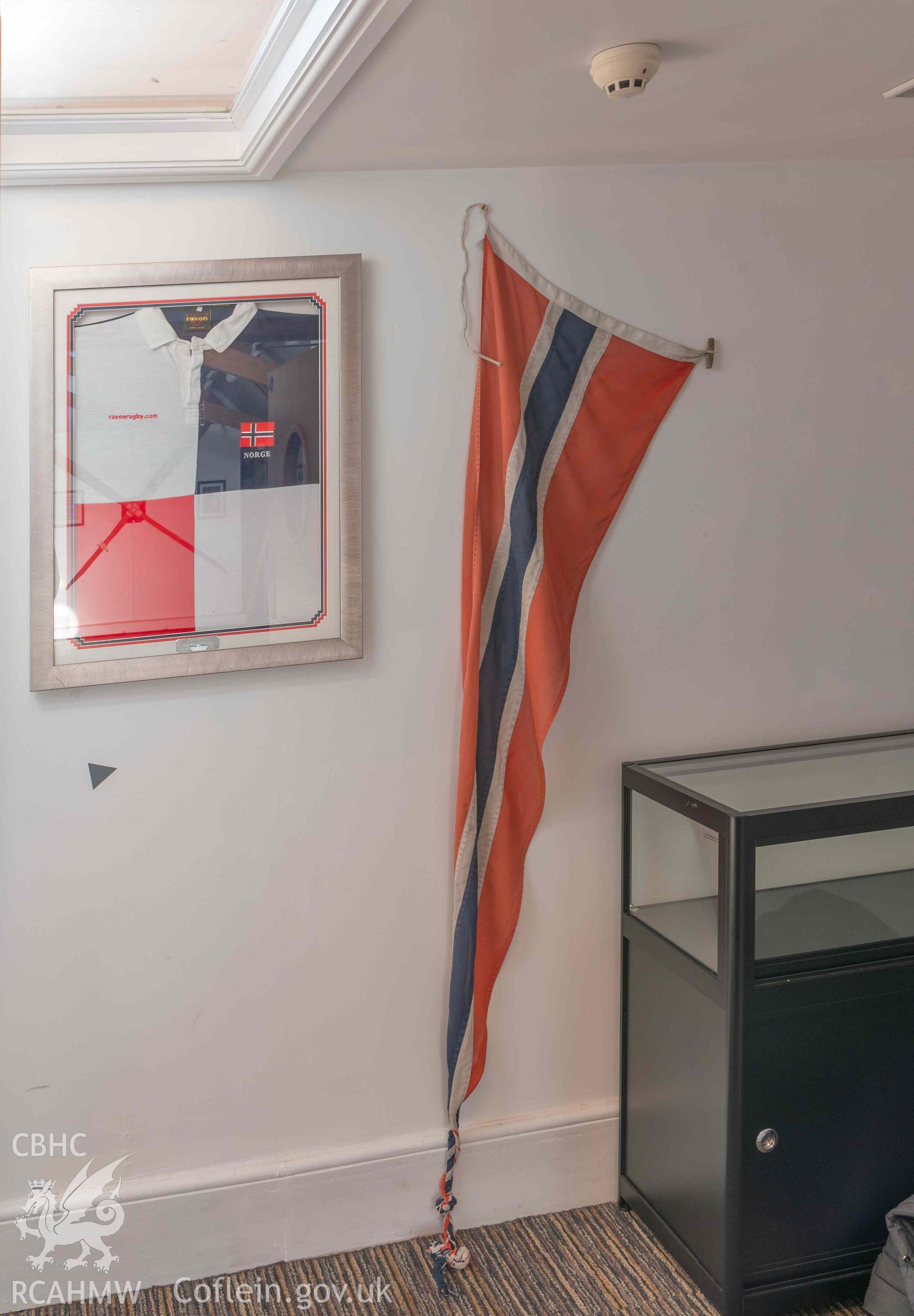 Norwegian Church - View of the portraited Norwegian rugby shirt and a  Norwegian flag, taken from North-East