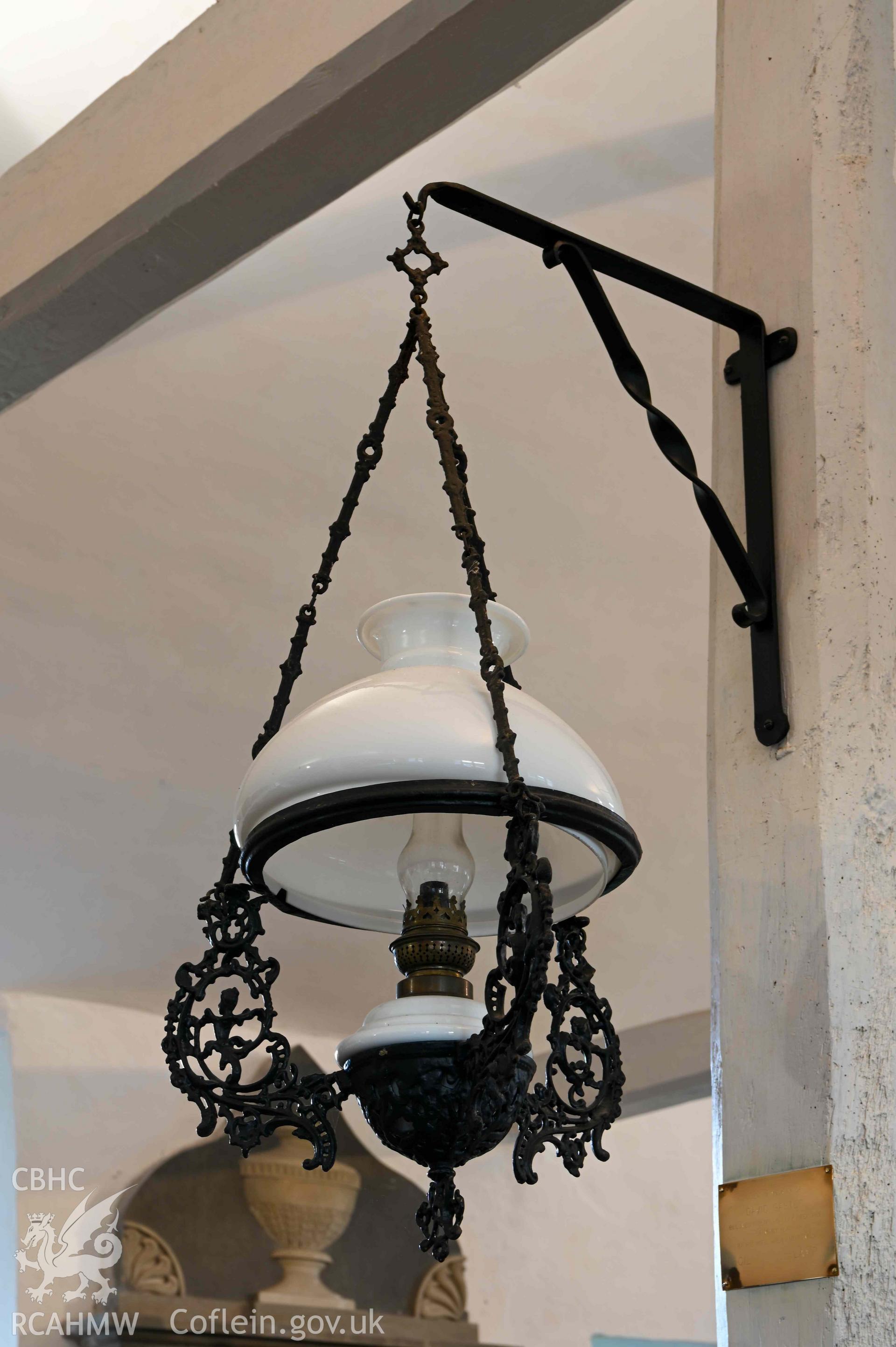 Maesyronen Chapel House - Detailed view of a lamp on a wall-mounted bracket, taken from South