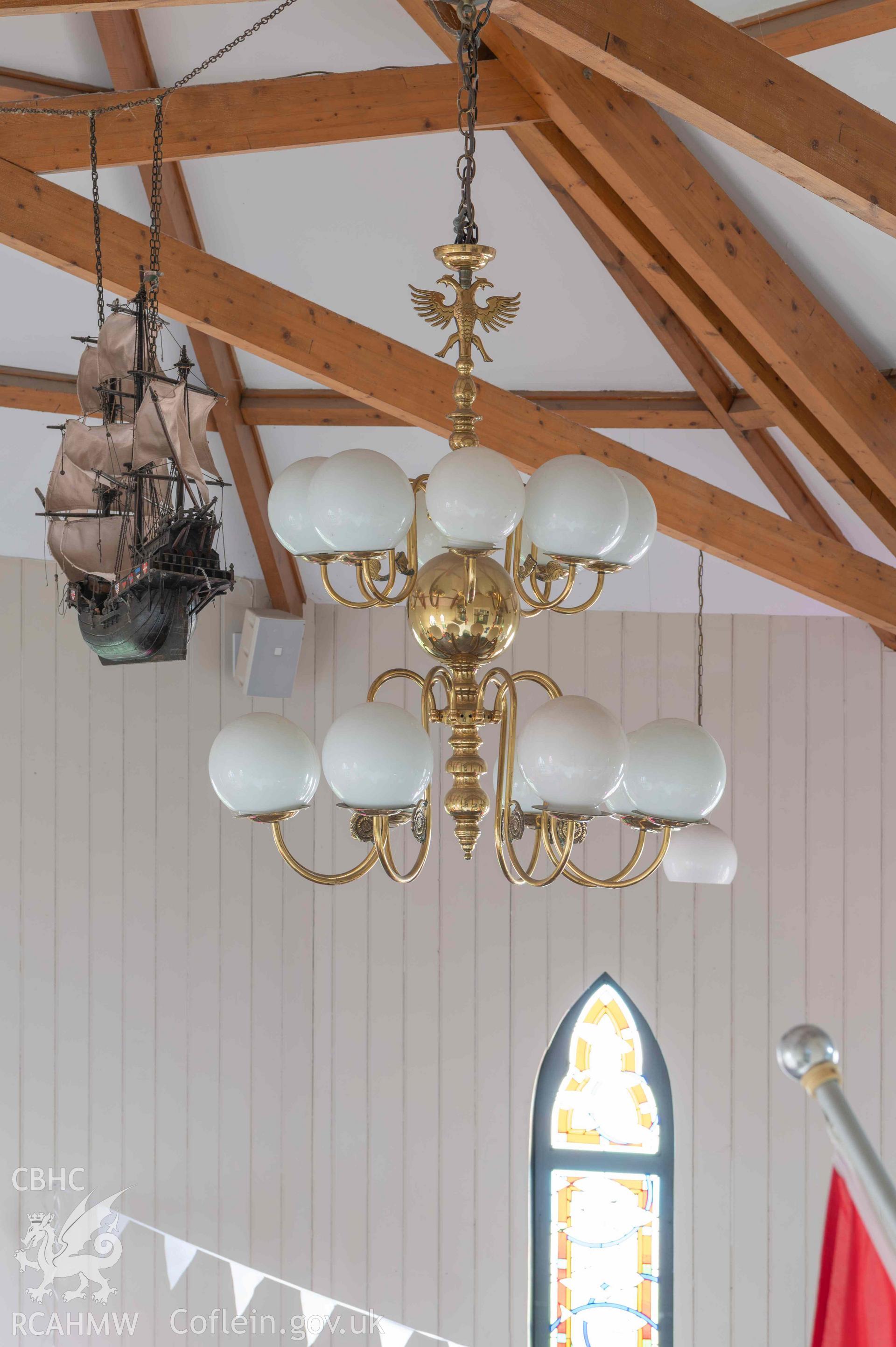 Norwegian Church - Detailed view of the chandelier and hanging ship from the mezzanine floor, taken from East