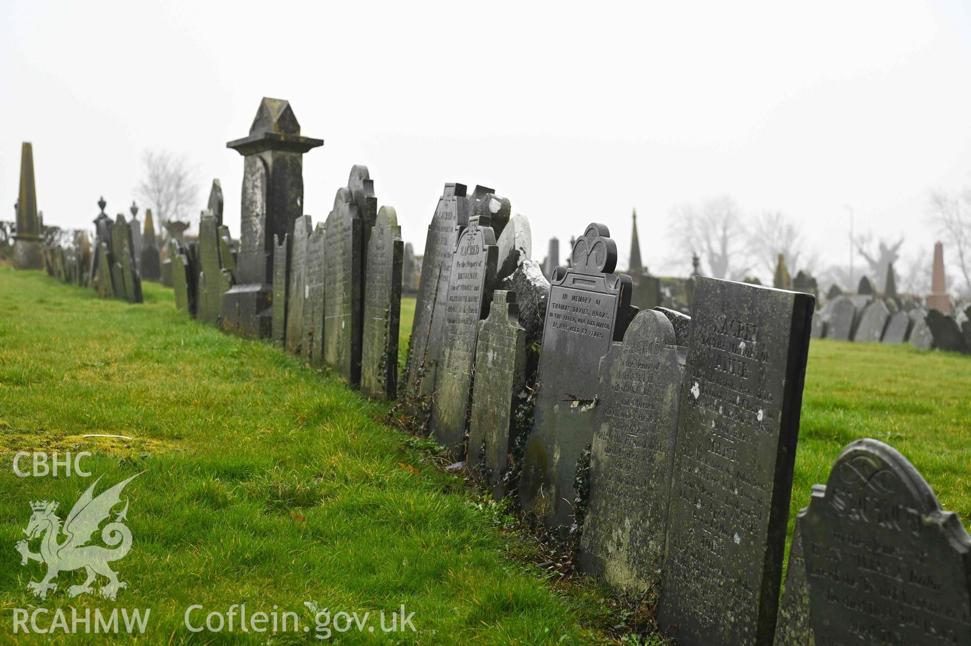 Bethlehem Welsh Independent Chapel - View of a row of gravestones by the chapel, taken from North