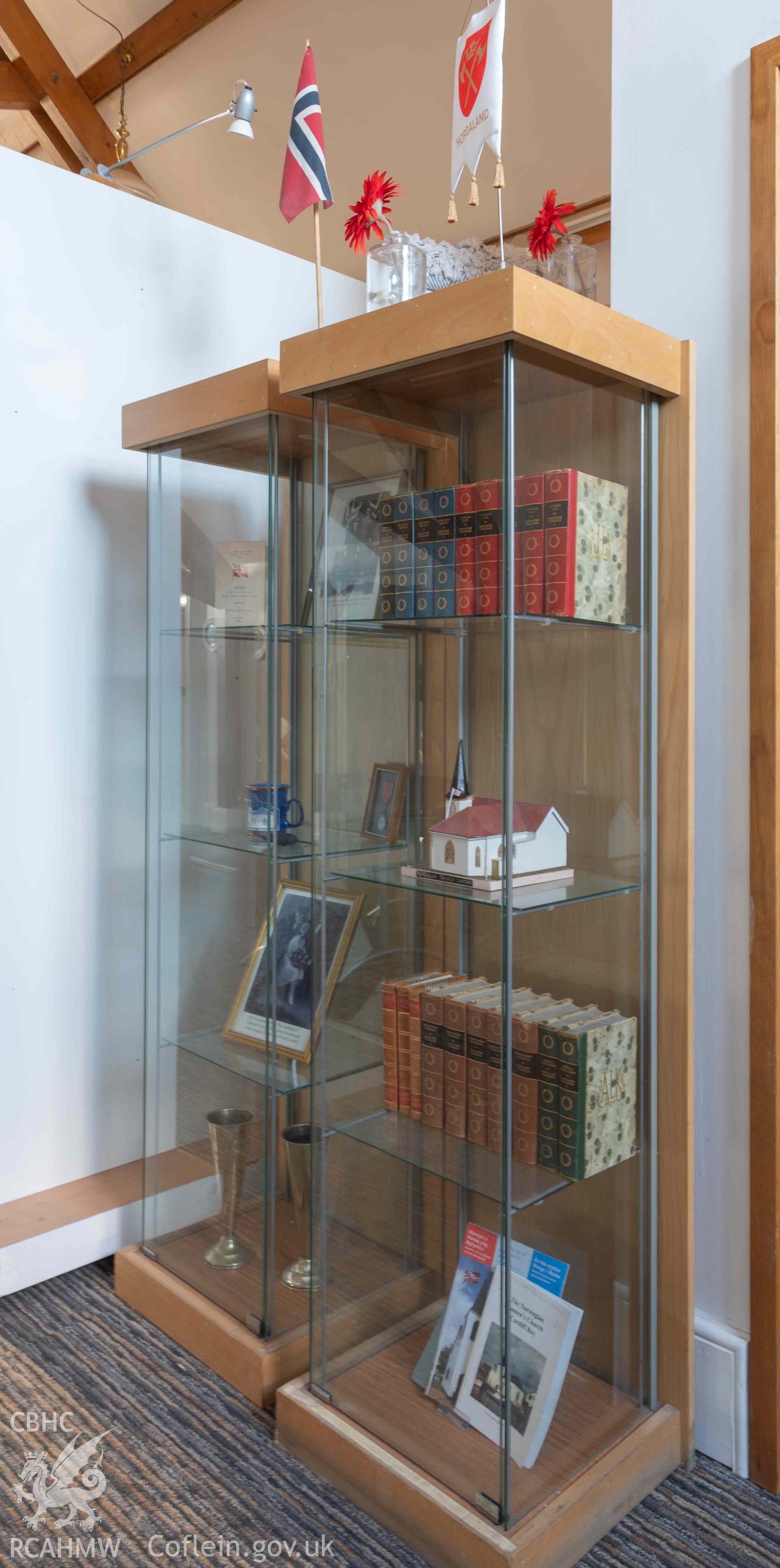 Norwegian Church - View of glass display cases on the mezzanine floor, taken from South-East