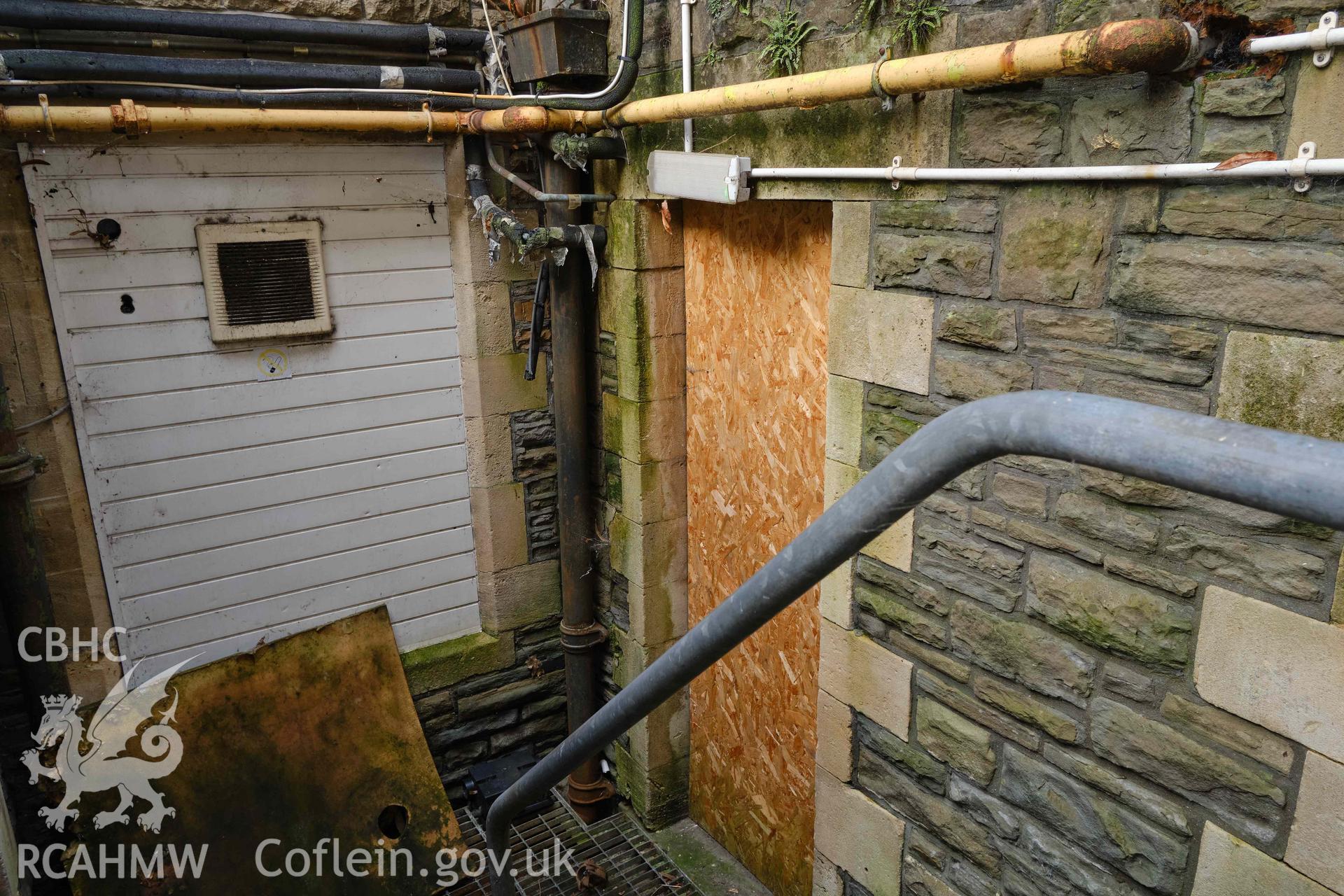 S front, boiler house entrance looking NE