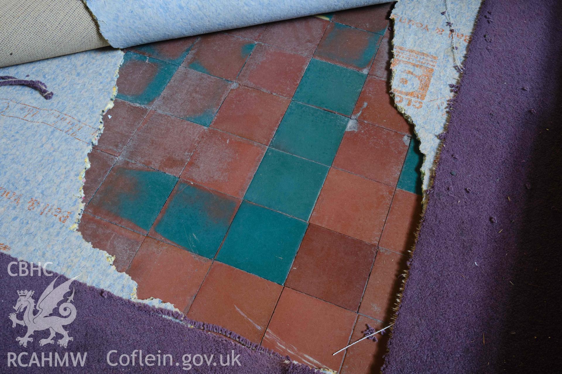 tile floor in stair hall (G1)