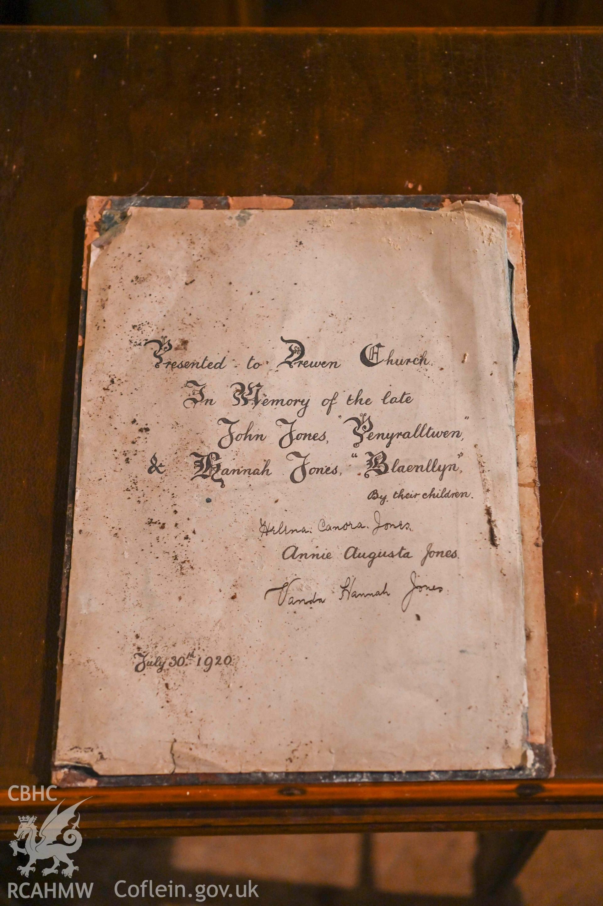 Tre-Wen Welsh Independent Chapel - Interior: Chapel, detailed view of a plaque-mounted sign gifted to Drewen Church in 1920 by the children of the late John and Hannah Jones, taken from West