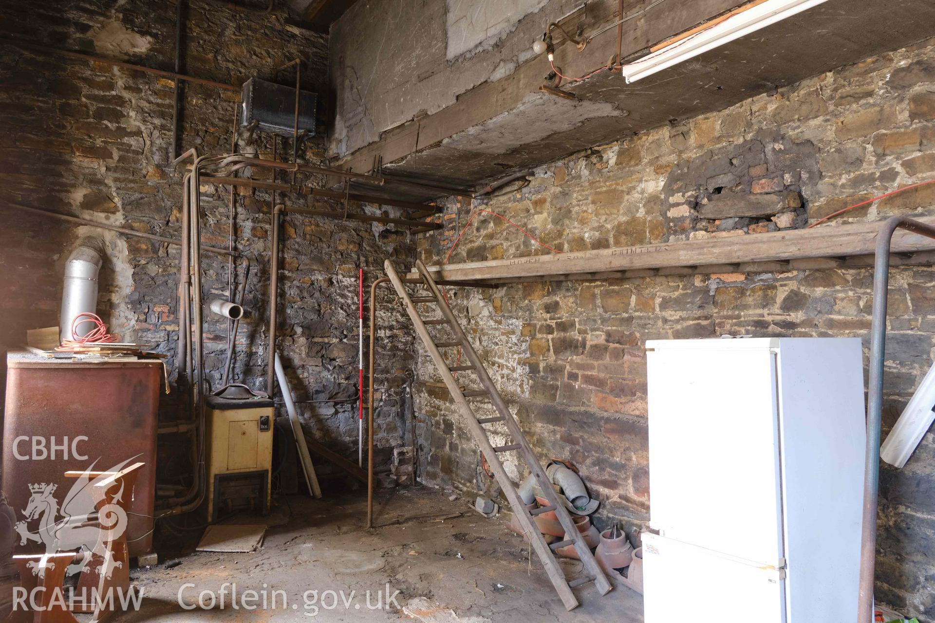 basement store room looking W