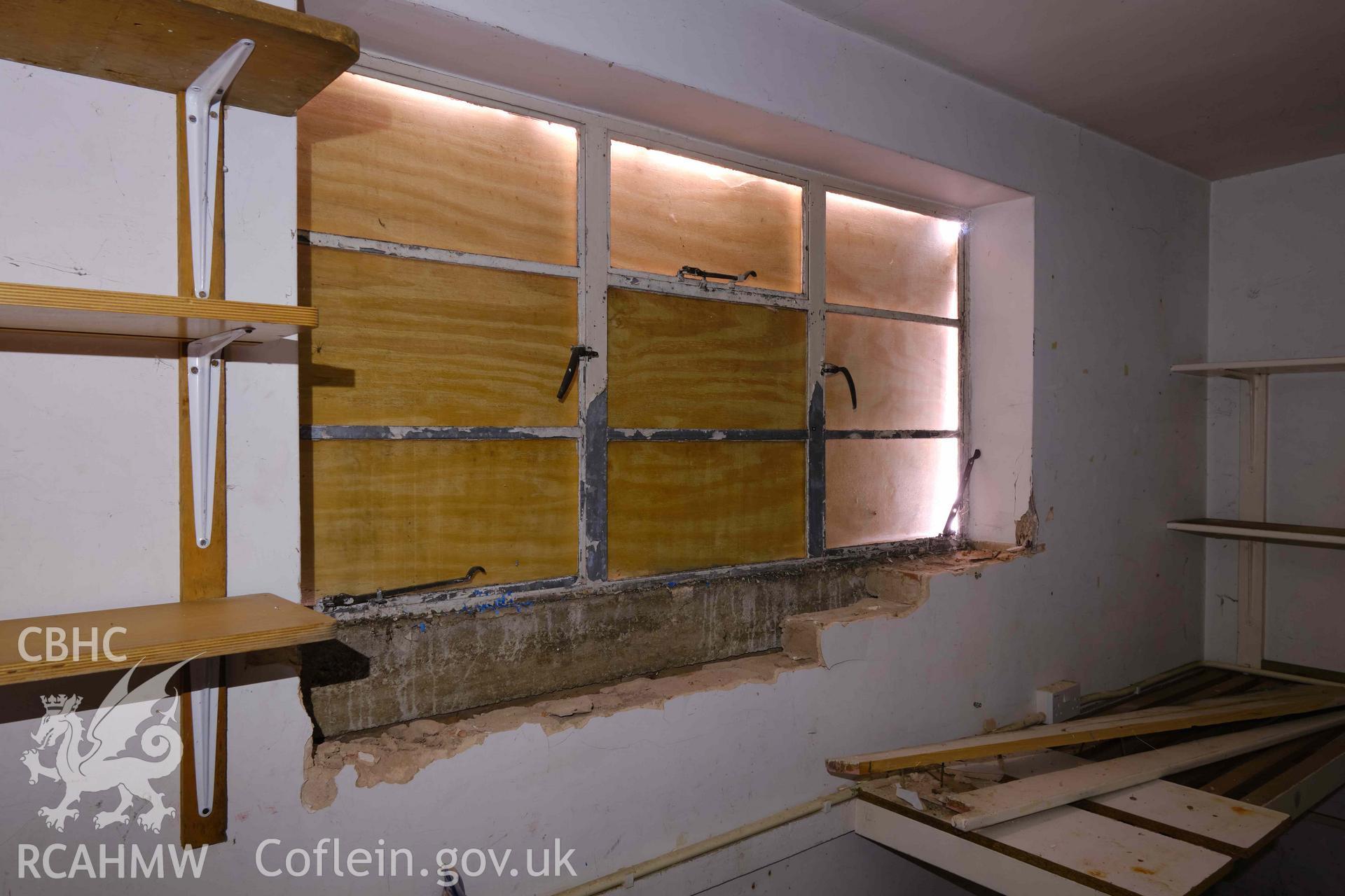 store attached to classroom 3, window frame looking W from interior