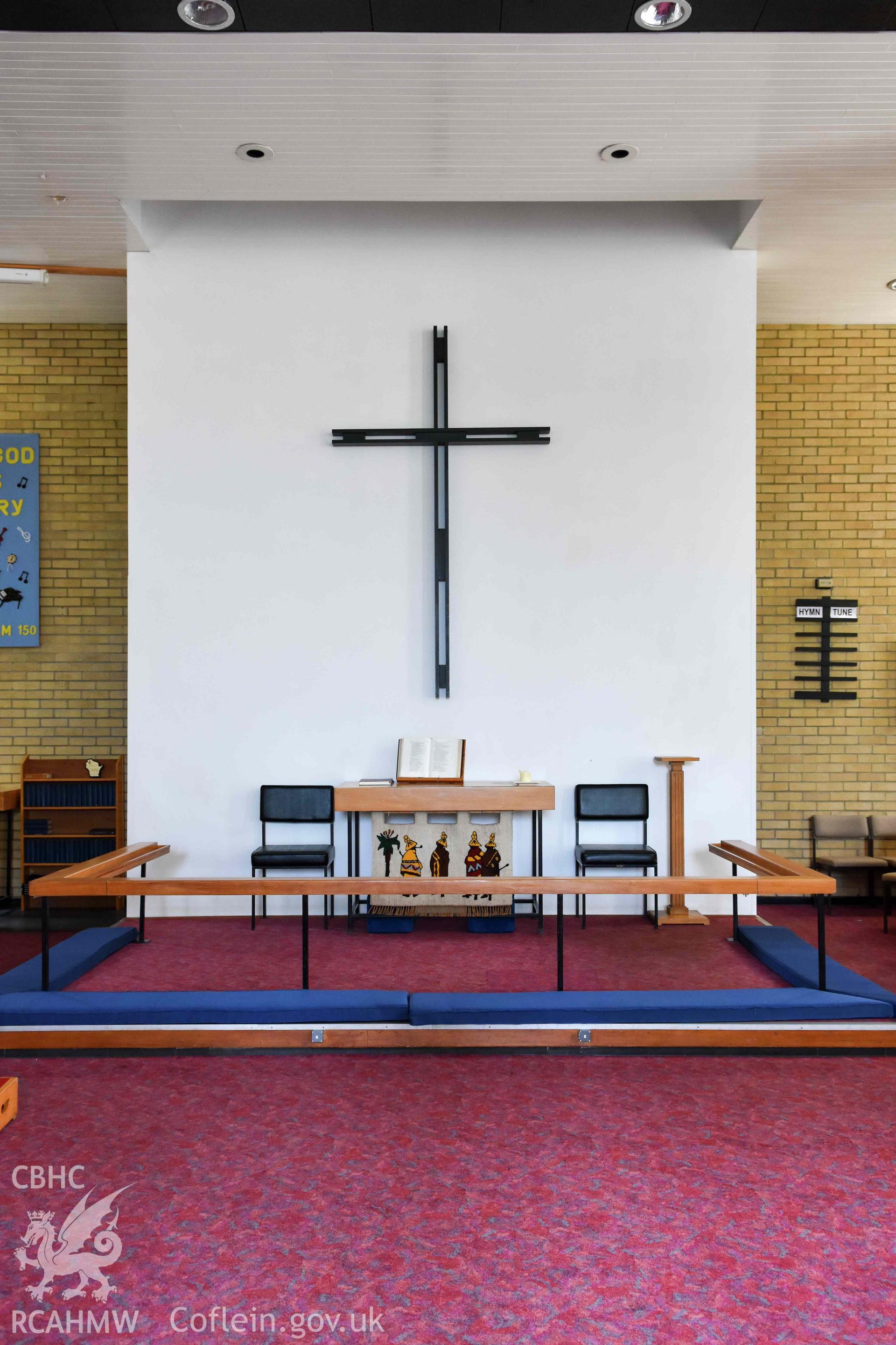 Cyncoed Methodist Church, interior auditorium detail of east end sedd fawr dias with communium table and cross