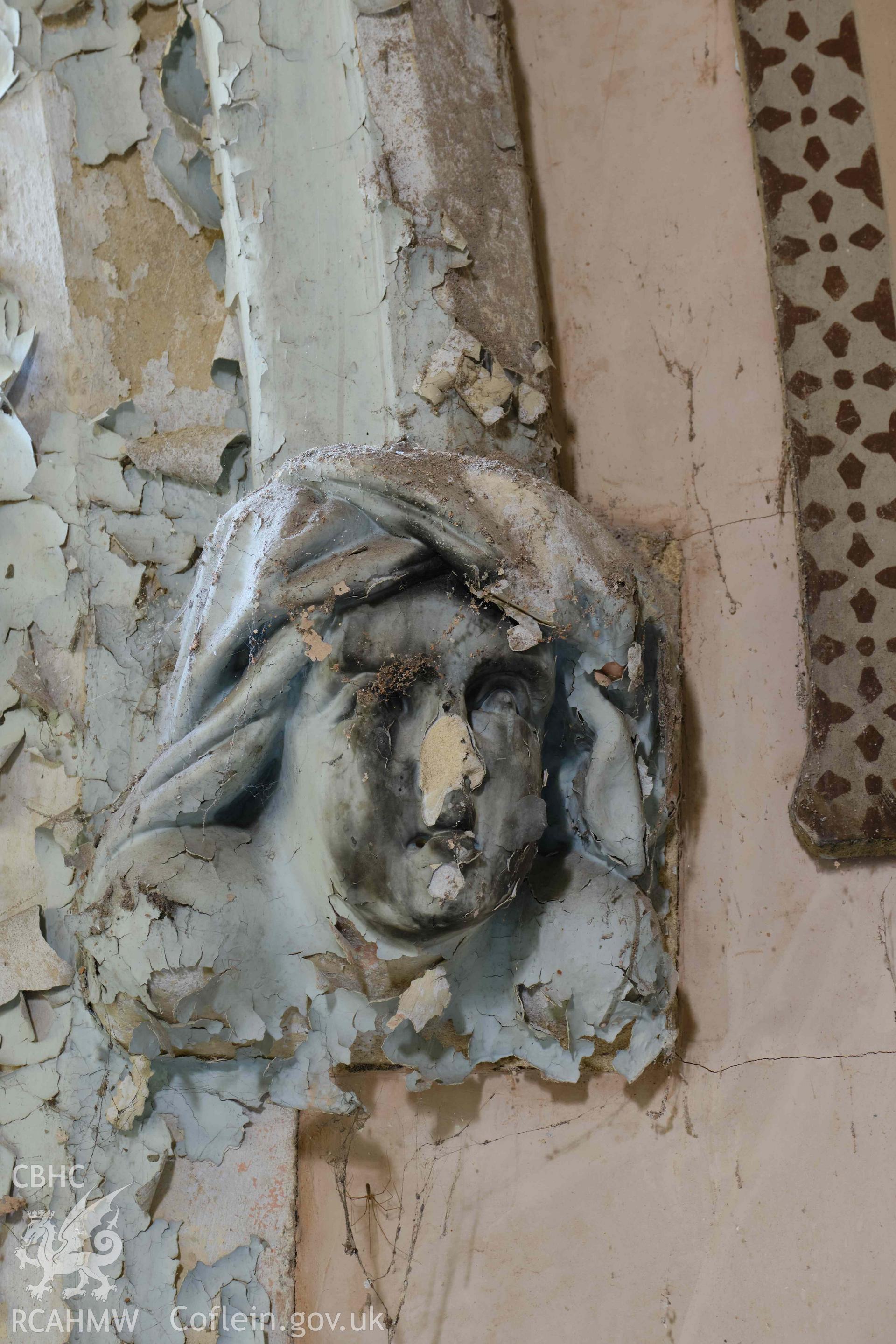 head stop, chancel arch S side