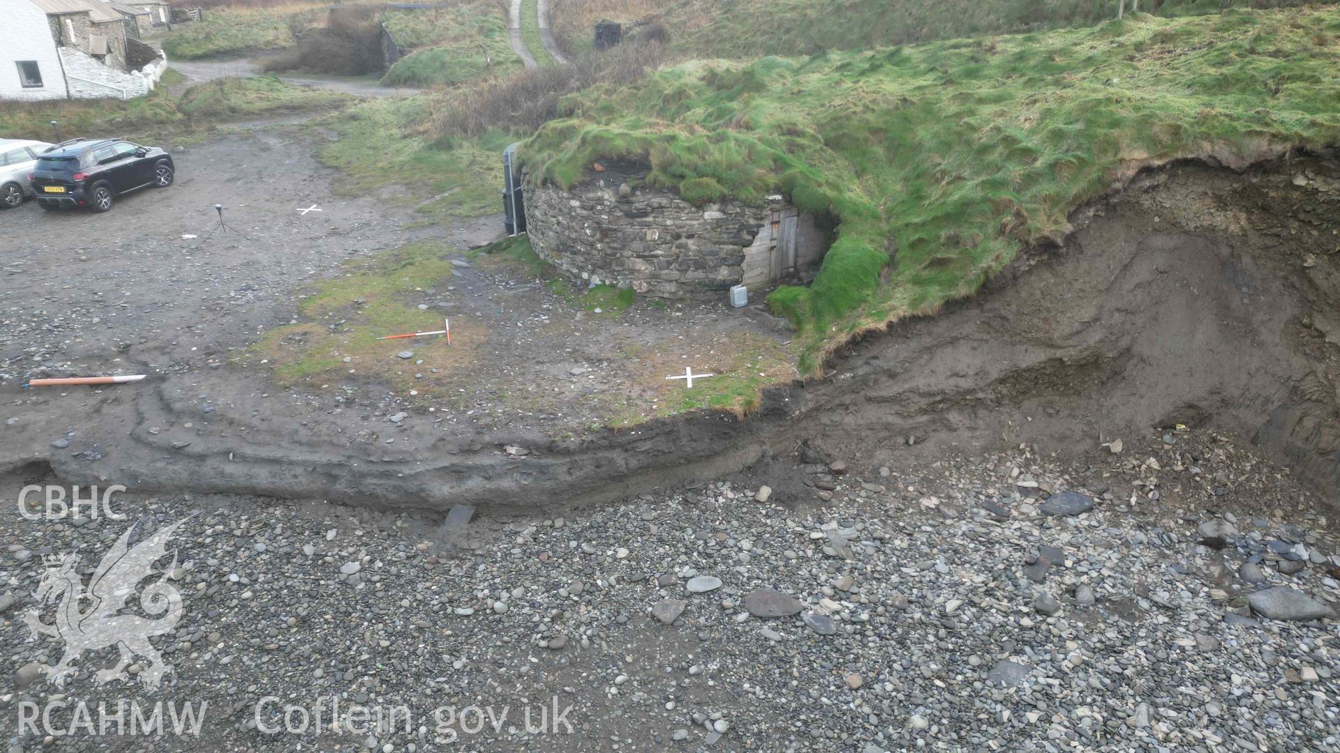 Oblique view, looking east, of Lime Kiln 1 at Abereiddi/Abereiddy on 11/12/2024. An area of fresh erosion is visible to seaward, and to the south of the lime kiln. Scales are 1m.