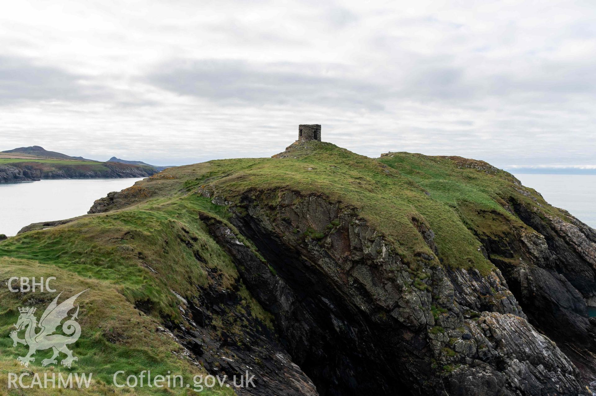 Trwyn Castell coastal promontory fort. View looking southwest over defences situated across the narrowest point of the promontory into the fort interior.