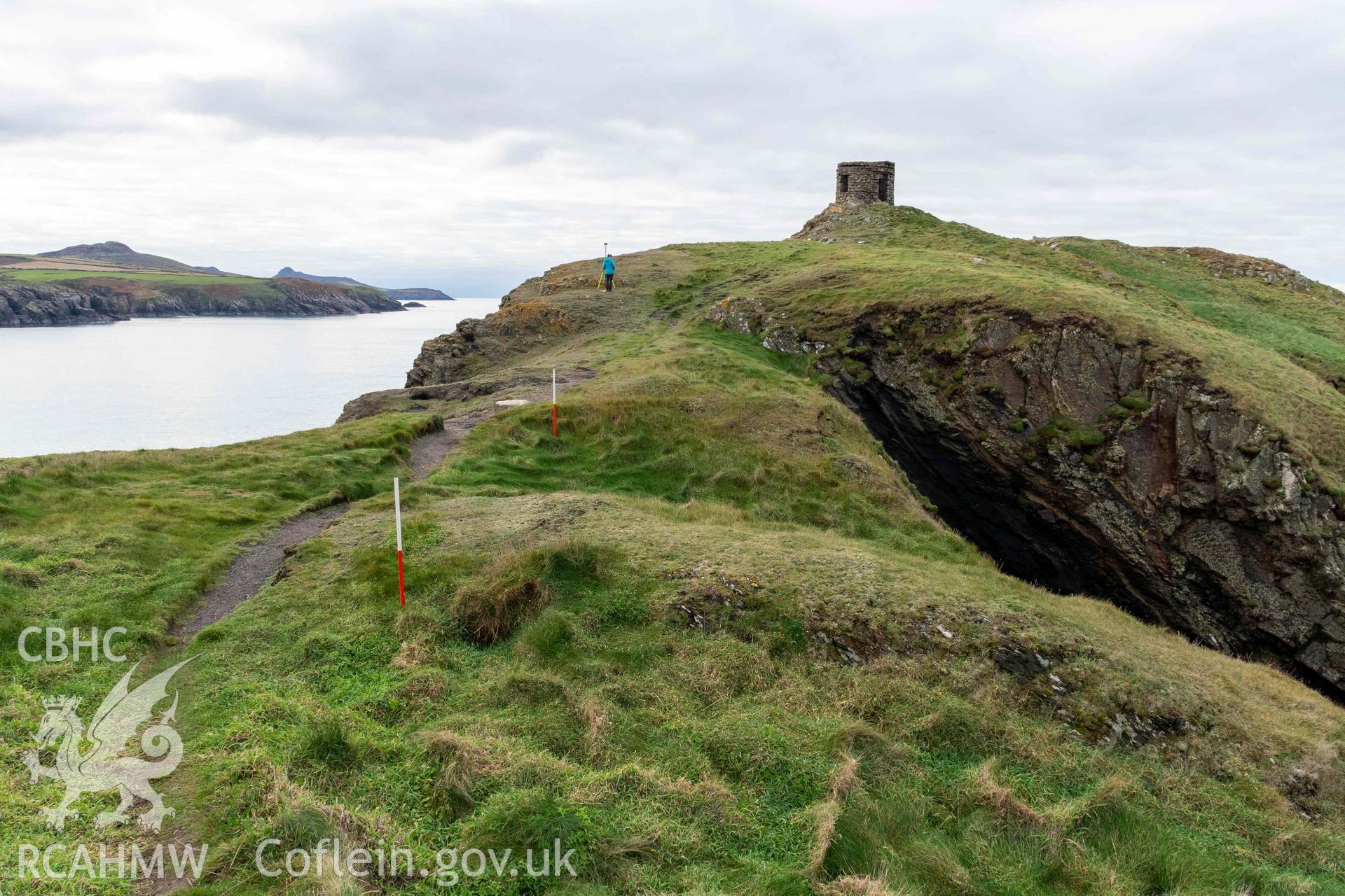 Trwyn Castell coastal promontory fort. View looking west over the multivallate defences situated across the narrowest point of the promontory (with scale).