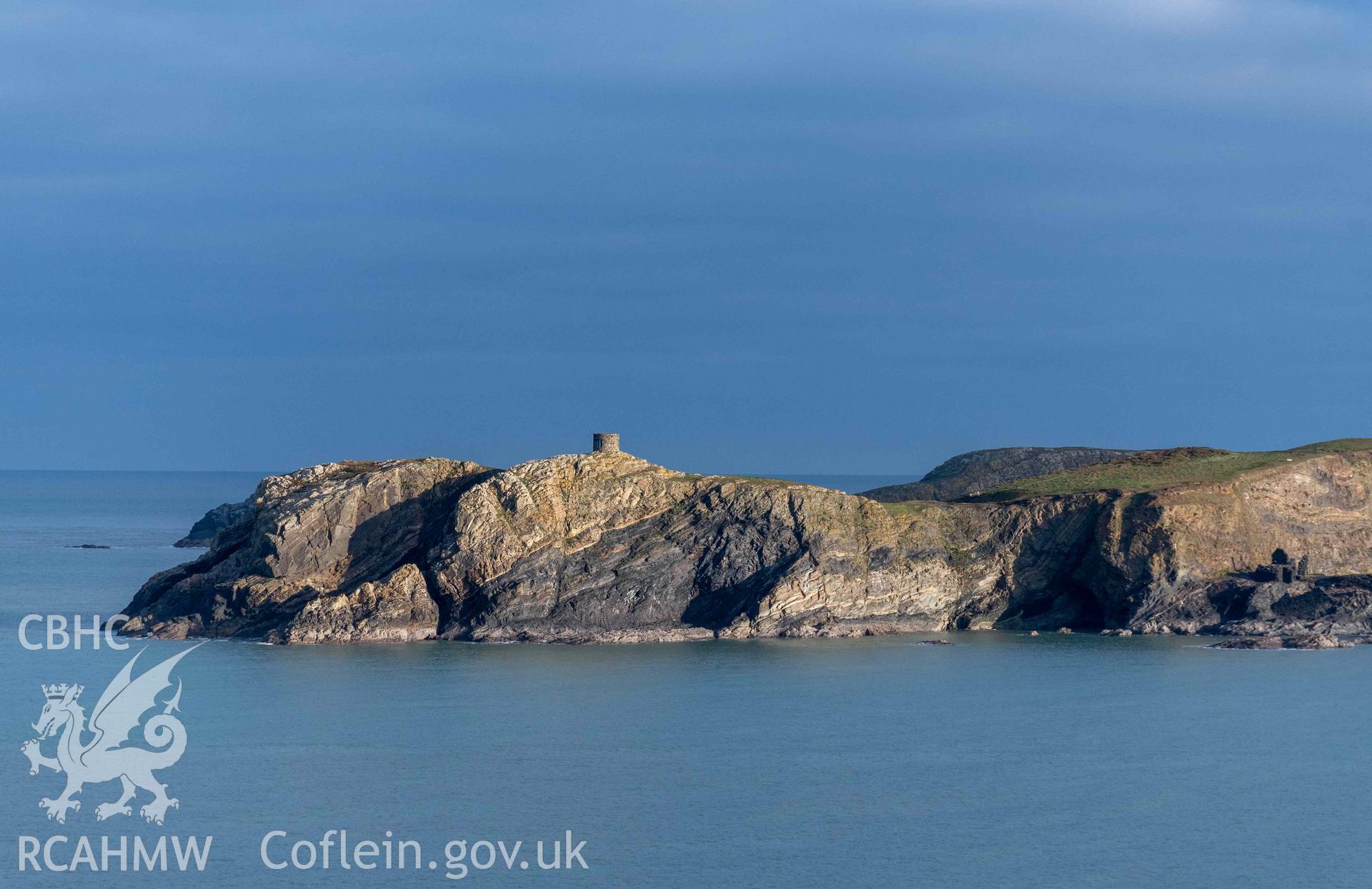 Trwyn Castell coastal promontory fort and Abereiddi Tower. Distant view across Abereiddi Bay from the south.