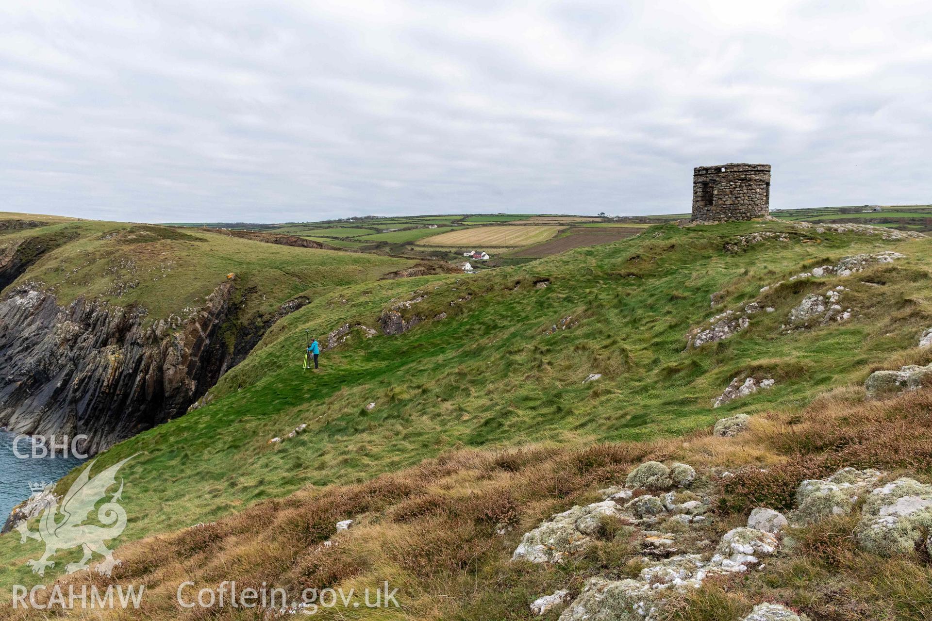 Trwyn Castell coastal promontory fort. Looking west over fort interior across an area of quarrying and potential house platforms.