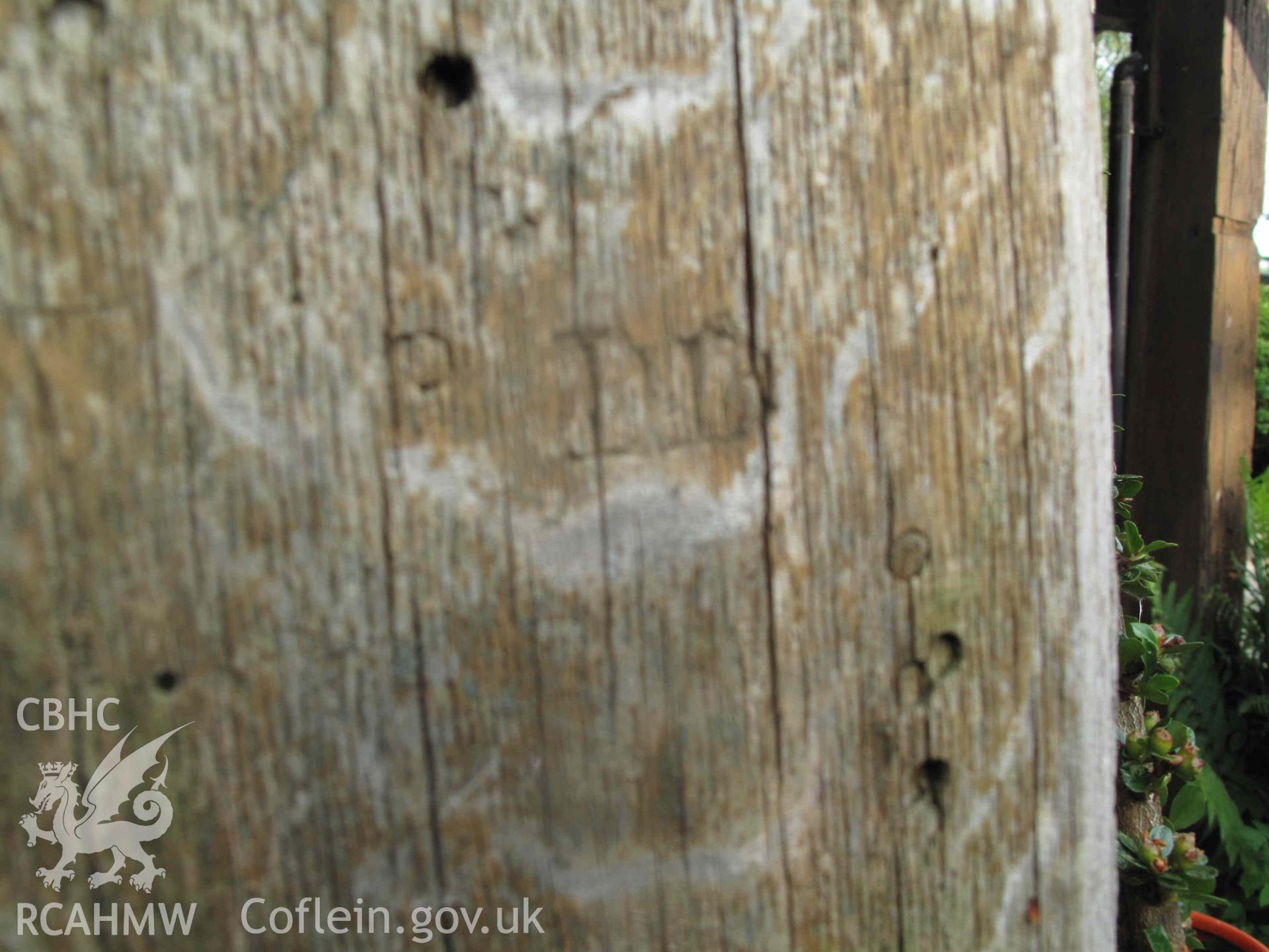 Ffatri Isaf,  Abercegir: carving on wooden post, "DD" visible.
