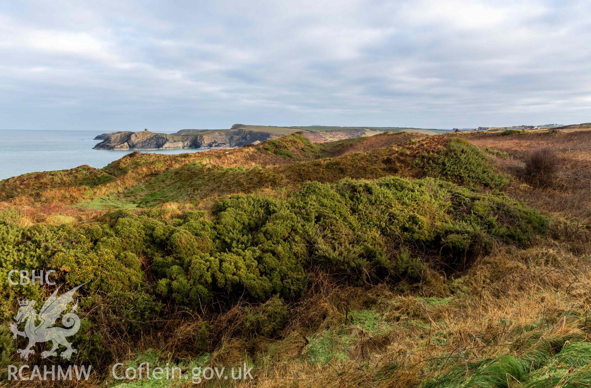 Caer Aber Pwll coastal promontory fort. Looking northeast across the middle and inner defences defining the western side of the fort.