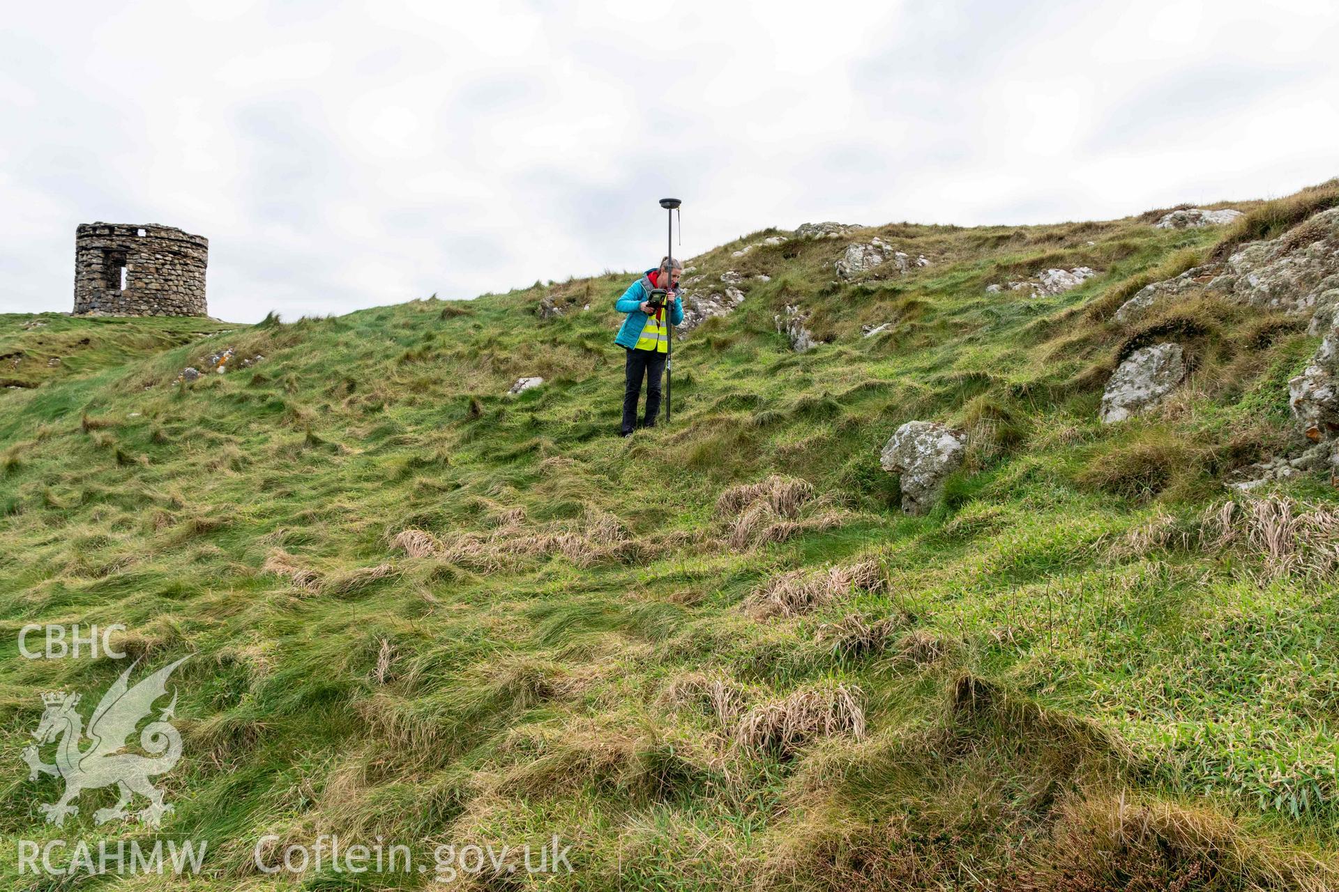 Trwyn Castell coastal promontory fort. Surveying potential house platfroms on the north side of the fort interior.