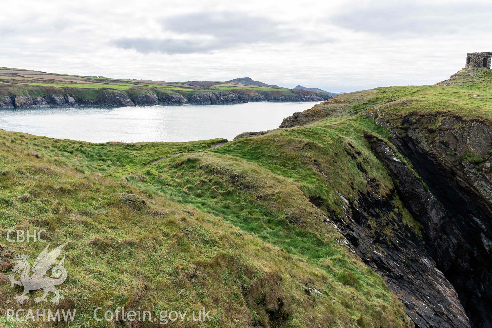 Trwyn Castell coastal promontory fort. View looking southwest over the multivallate defences situated across the narrowest point of the promontory.