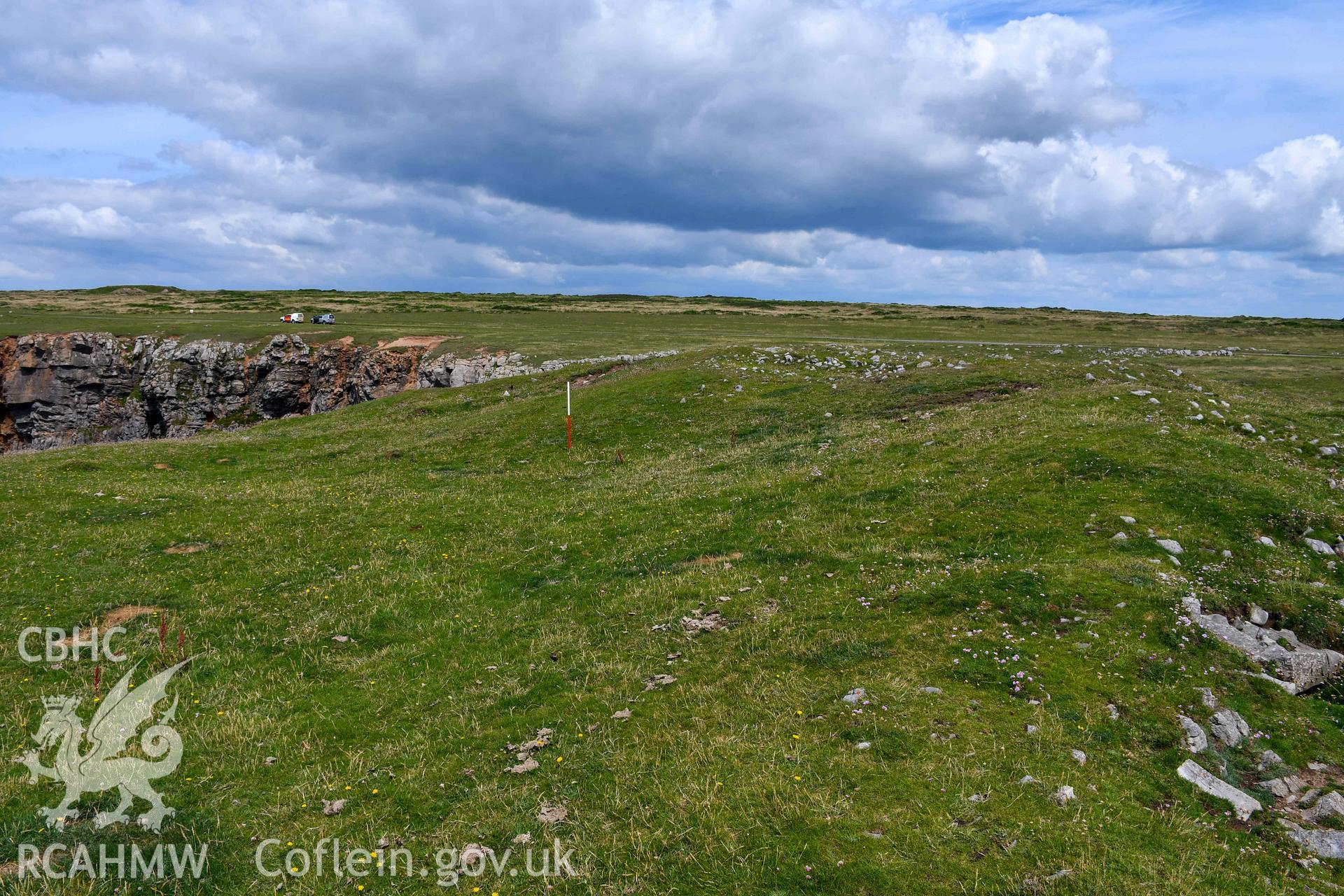 Looking north along the inside face of the inner rampart bank (with scale).