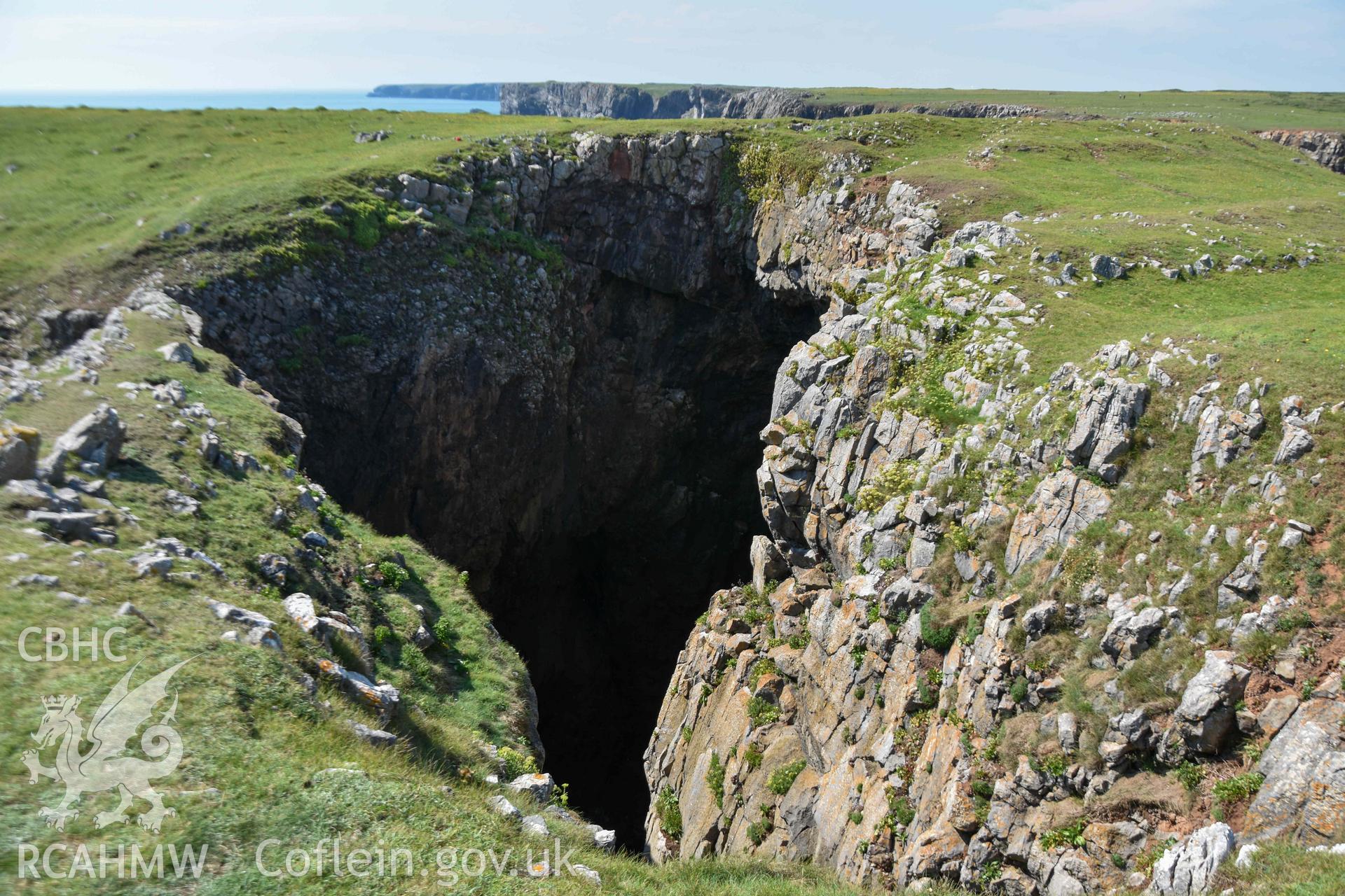 Looking north across the blow-hole to the fort's defences.