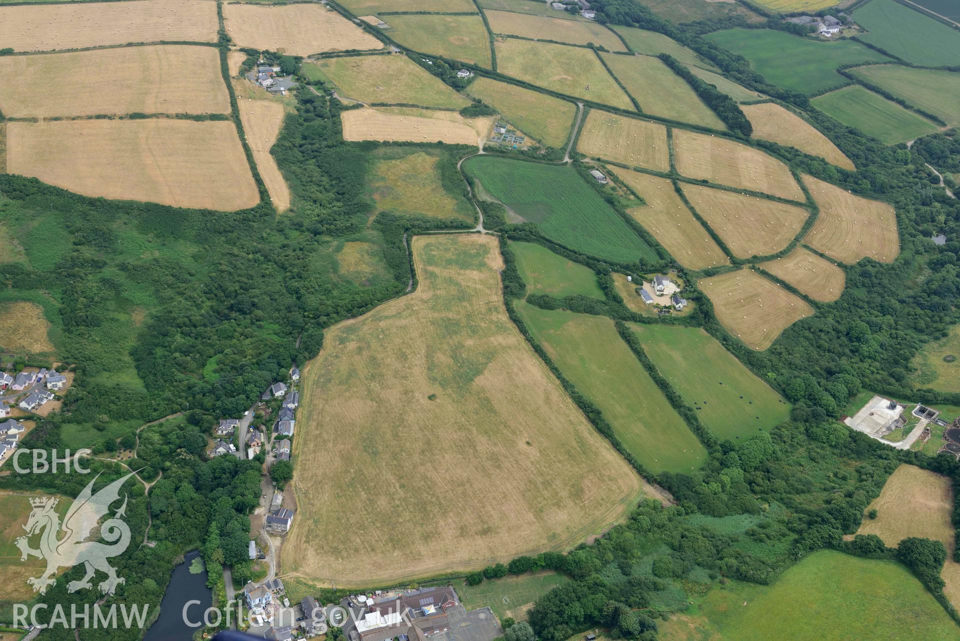 RCAHMW colour oblique aerial photograph of  Swanswell Farm, Broadhaven, defended enclosure CM taken on 11 July 2018 by Toby Driver