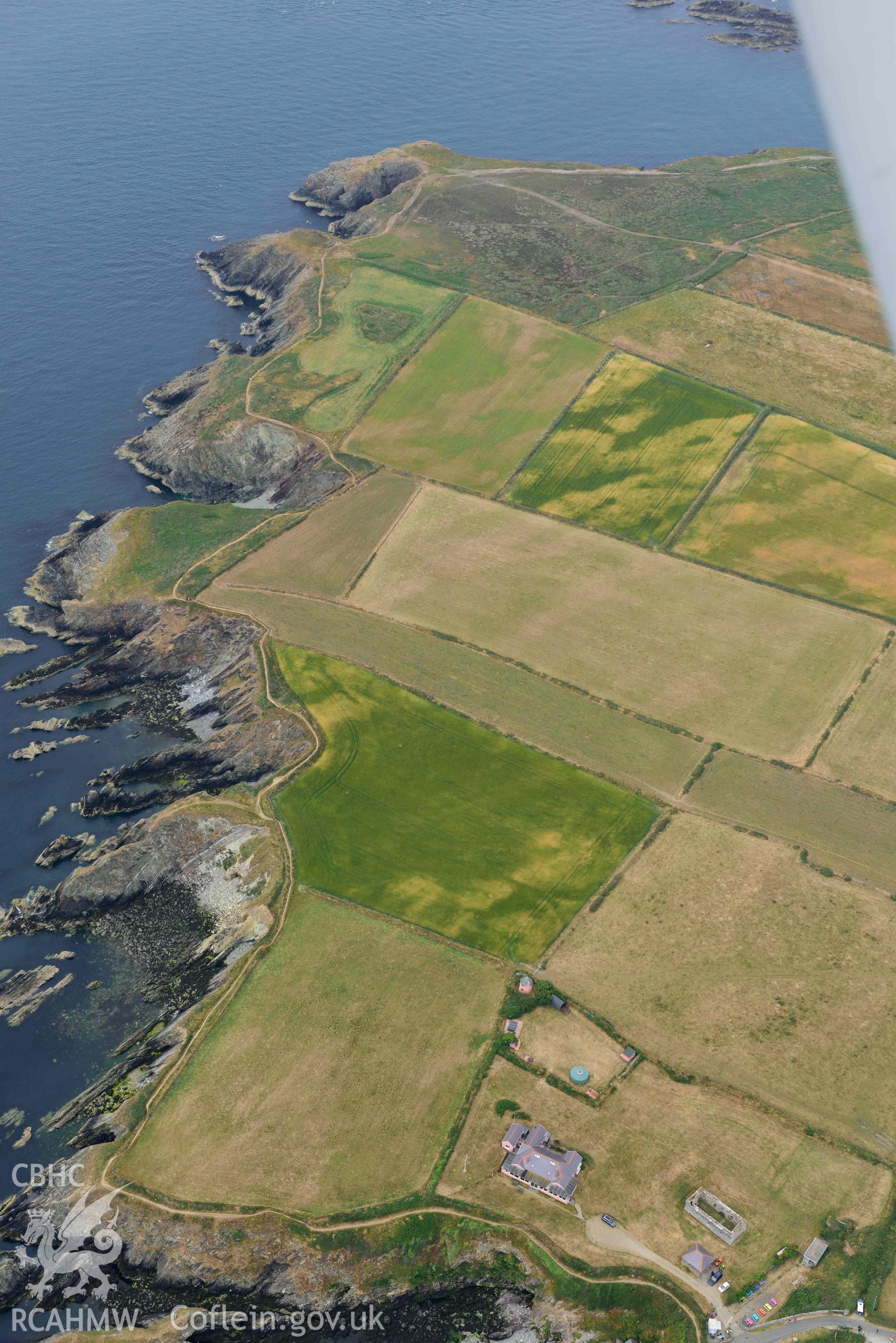 RCAHMW colour oblique aerial photograph of St Justinian's chapel, geological cropmarks NW of taken on 11 July 2018 by Toby Driver