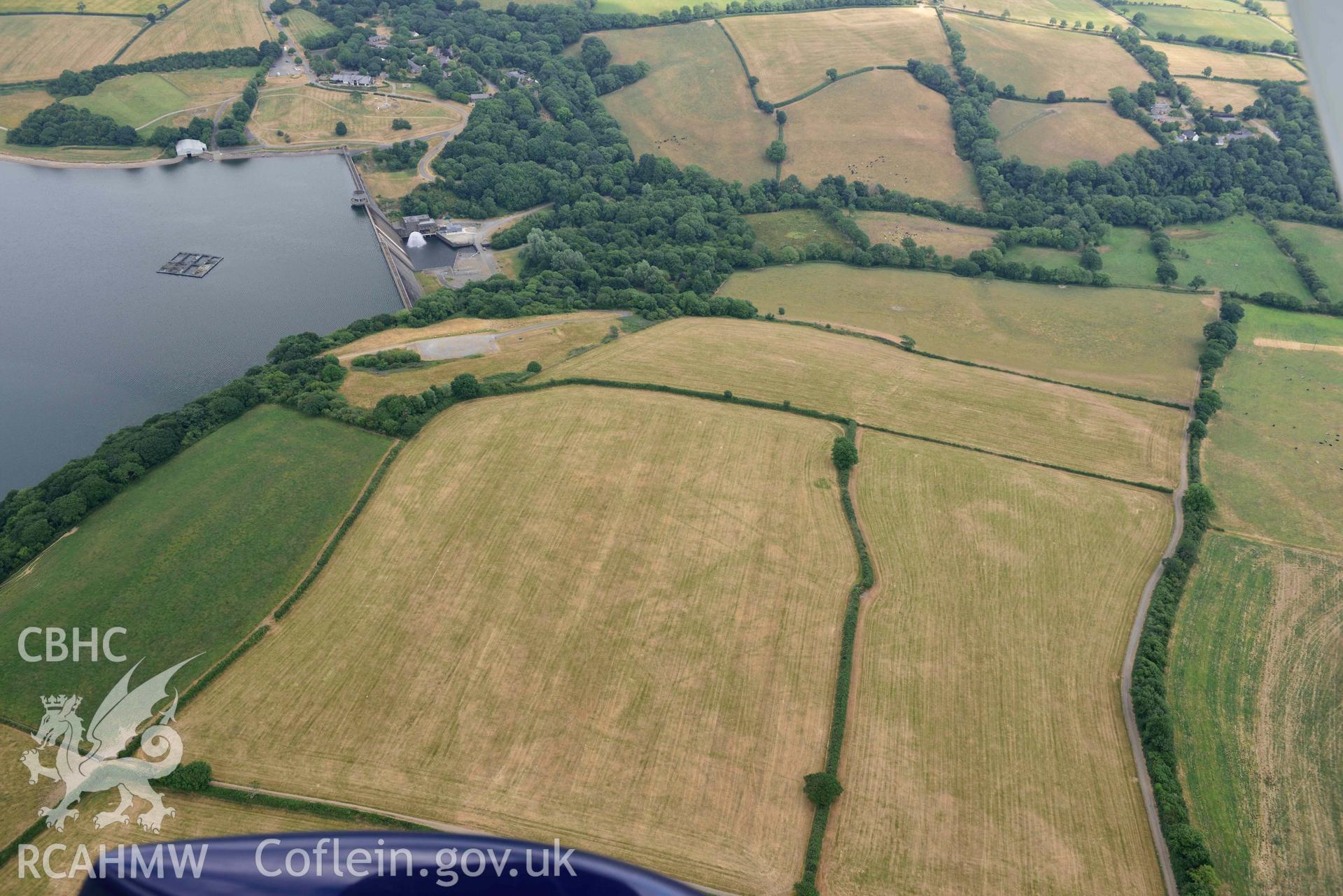 RCAHMW colour oblique aerial photograph of Llys y Fran Walton wood enclosures taken on 11 July 2018 by Toby Driver