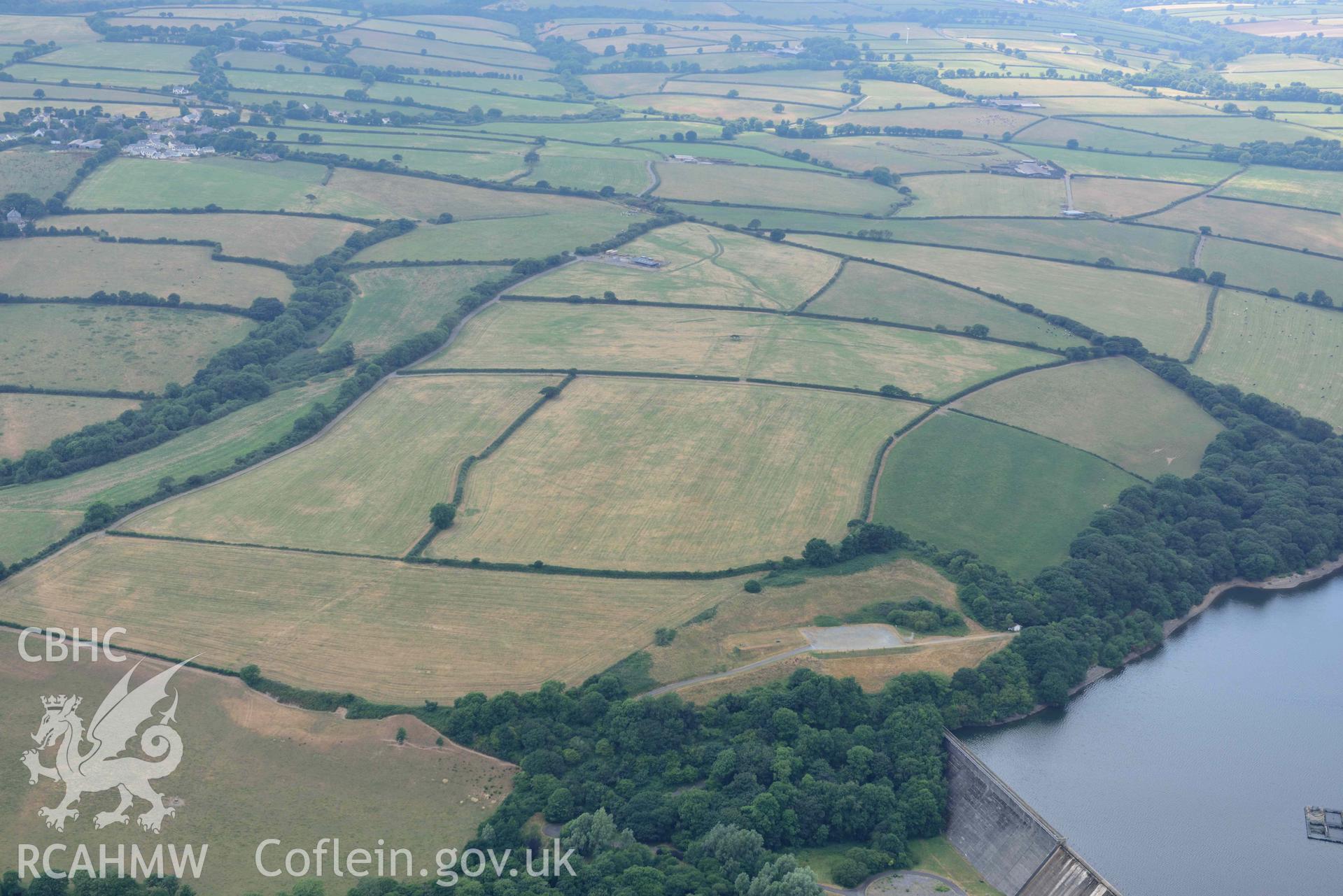 RCAHMW colour oblique aerial photograph of Llys y Fran Walton wood enclosures taken on 11 July 2018 by Toby Driver