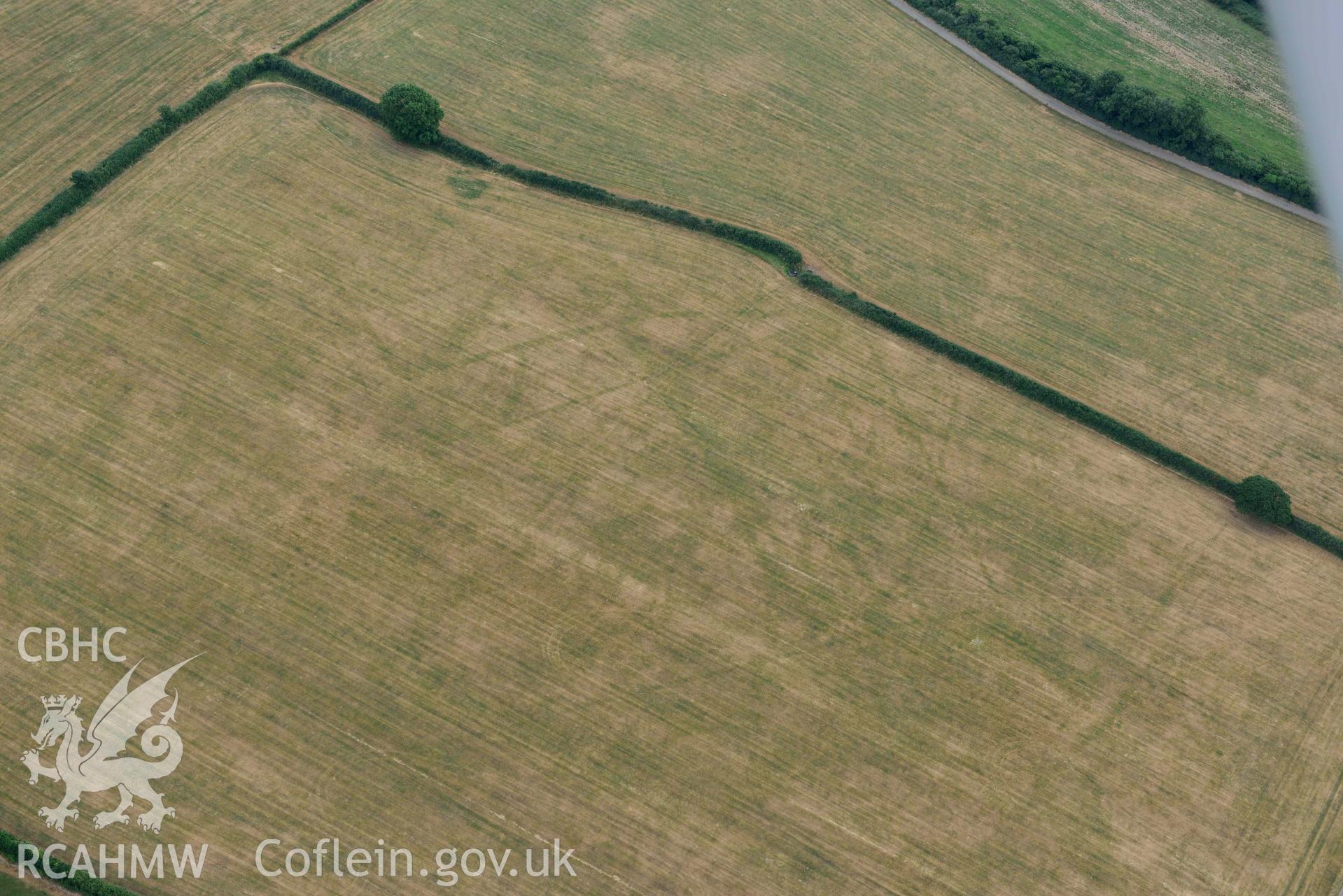 RCAHMW colour oblique aerial photograph of Llys y Fran Walton wood enclosures taken on 11 July 2018 by Toby Driver