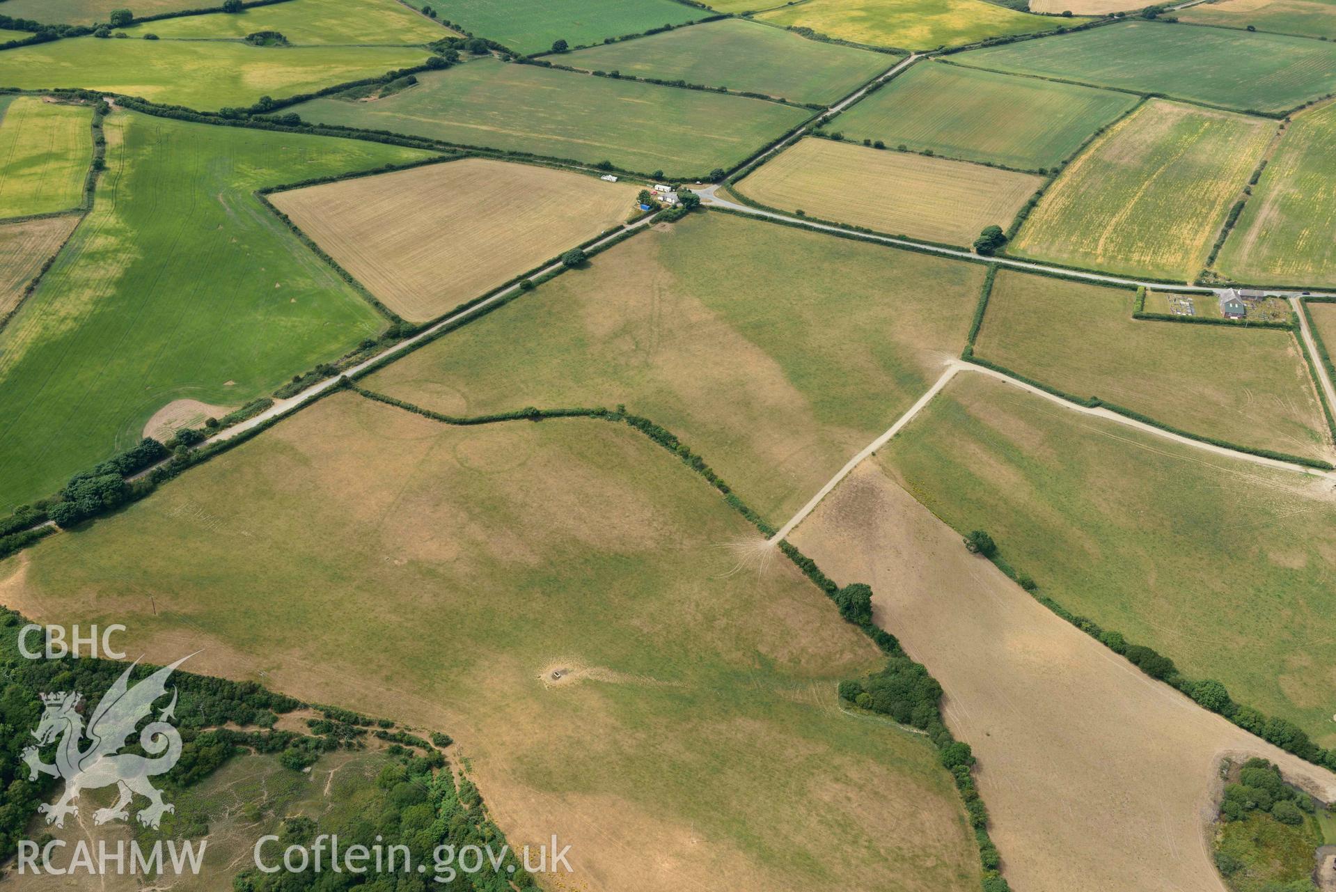 RCAHMW colour oblique aerial photograph of Post coch barrow pair and enclosure taken on 11 July 2018 by Toby Driver