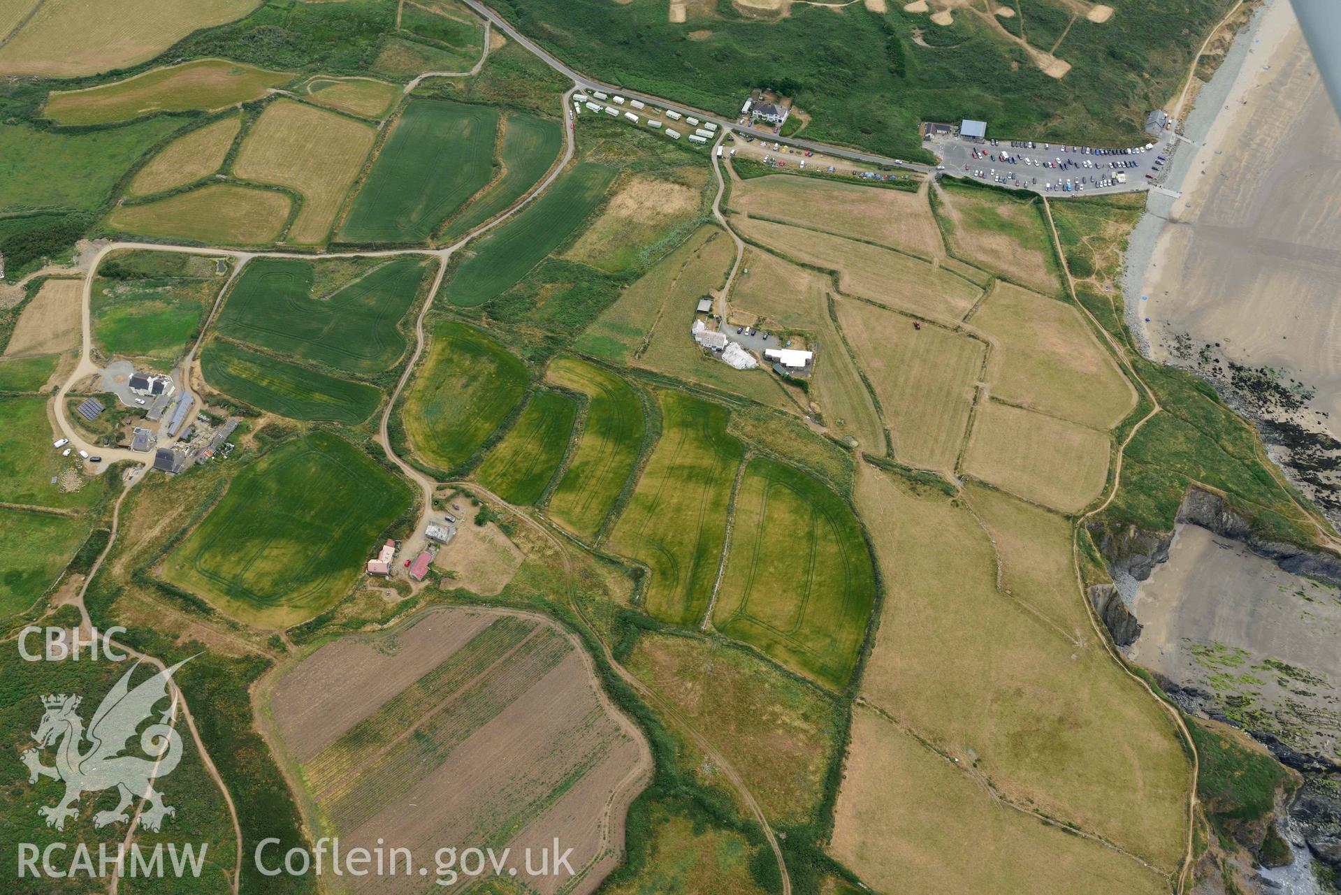 RCAHMW colour oblique aerial photograph of  St Patrick's Chapel taken on 11 July 2018 by Toby Driver