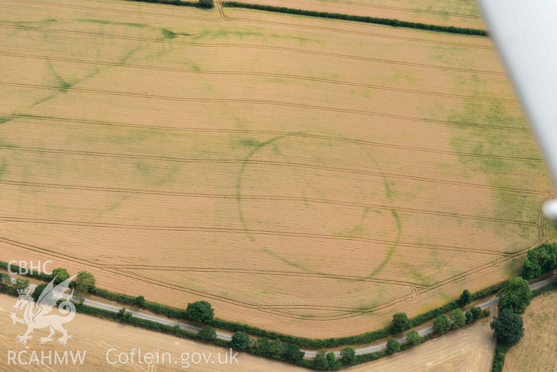 RCAHMW colour oblique aerial photograph of Cawrence enclosure taken on 11 July 2018 by Toby Driver