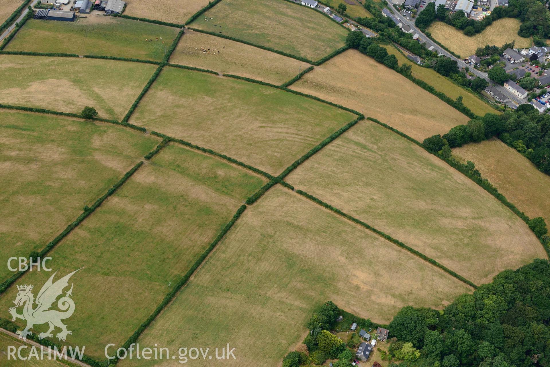 RCAHMW colour oblique aerial photograph of Newcastle Emlyn town & natural cropmarks to South taken on 11 July 2018 by Toby Driver