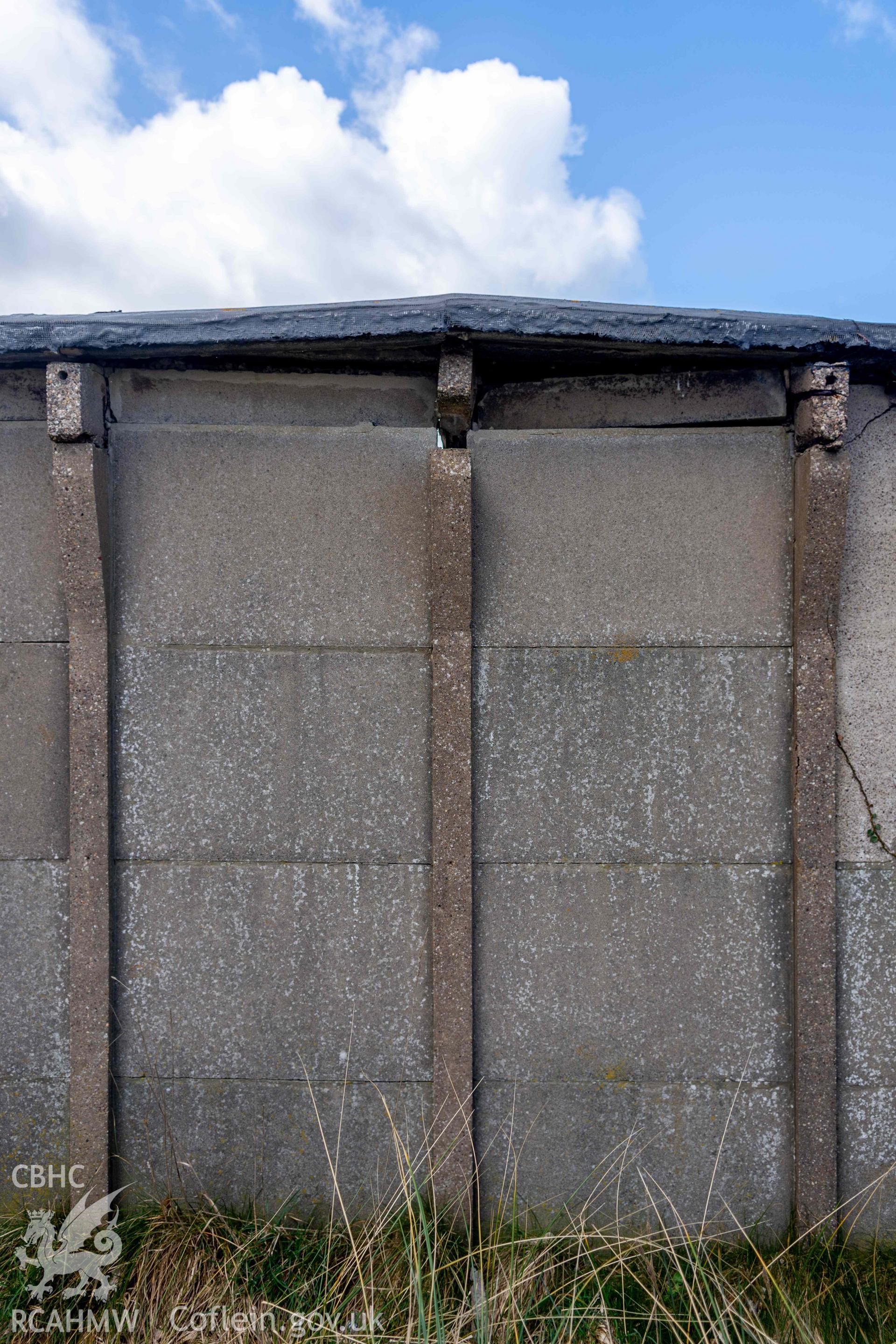 Ynyslas BCF Hut - Detailed view of prefabricated concrete posts on the Eastern wall of the hut, taken from East