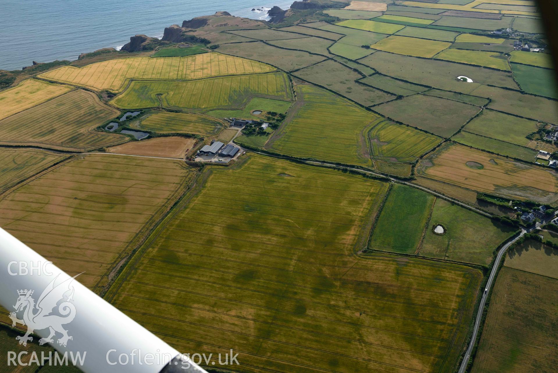 RCAHMW colour oblique aerial photograph of Paviland Manor, cropmark complex; view from NE taken on 17 July 2018 by Toby Driver (NGR: SS449863)