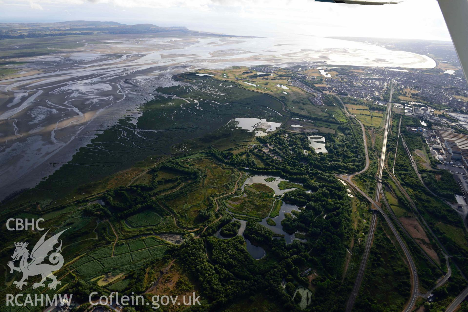 RCAHMW colour oblique aerial photograph of Llanelli,  Wetlands Centre taken on 17 July 2018 by Toby Driver