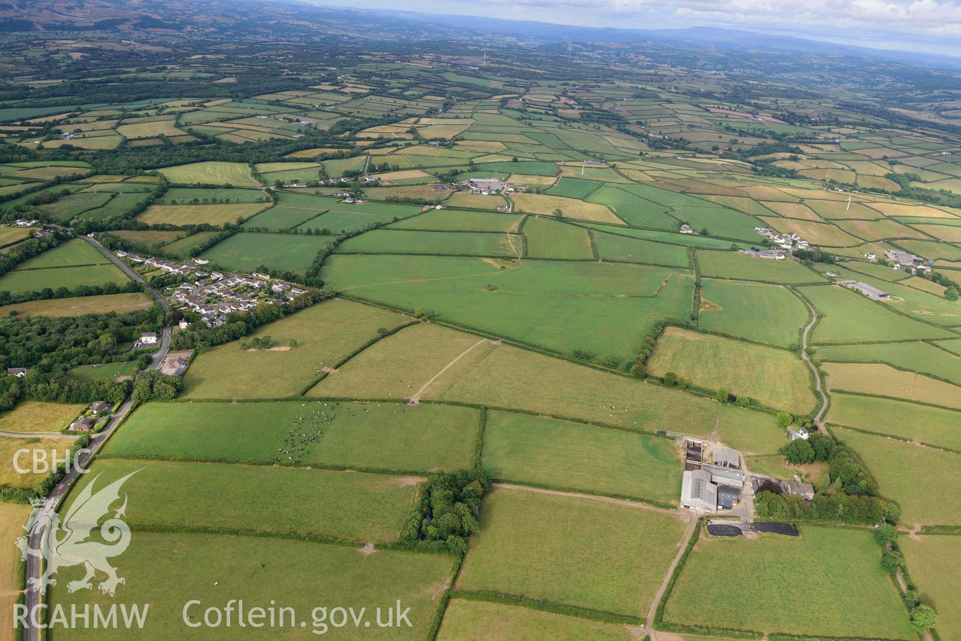 RCAHMW colour oblique aerial photograph of Idole, village, and line of Roman road, from W taken on 17 July 2018 by Toby Driver (NGR: SN423157)