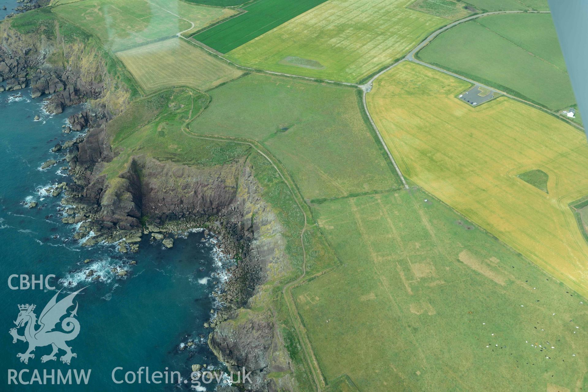 RCAHMW colour oblique aerial photograph of RAF Kete, parchmarks of demolished buildings taken on 17 July 2018 by Toby Driver (NGR: SM799040)