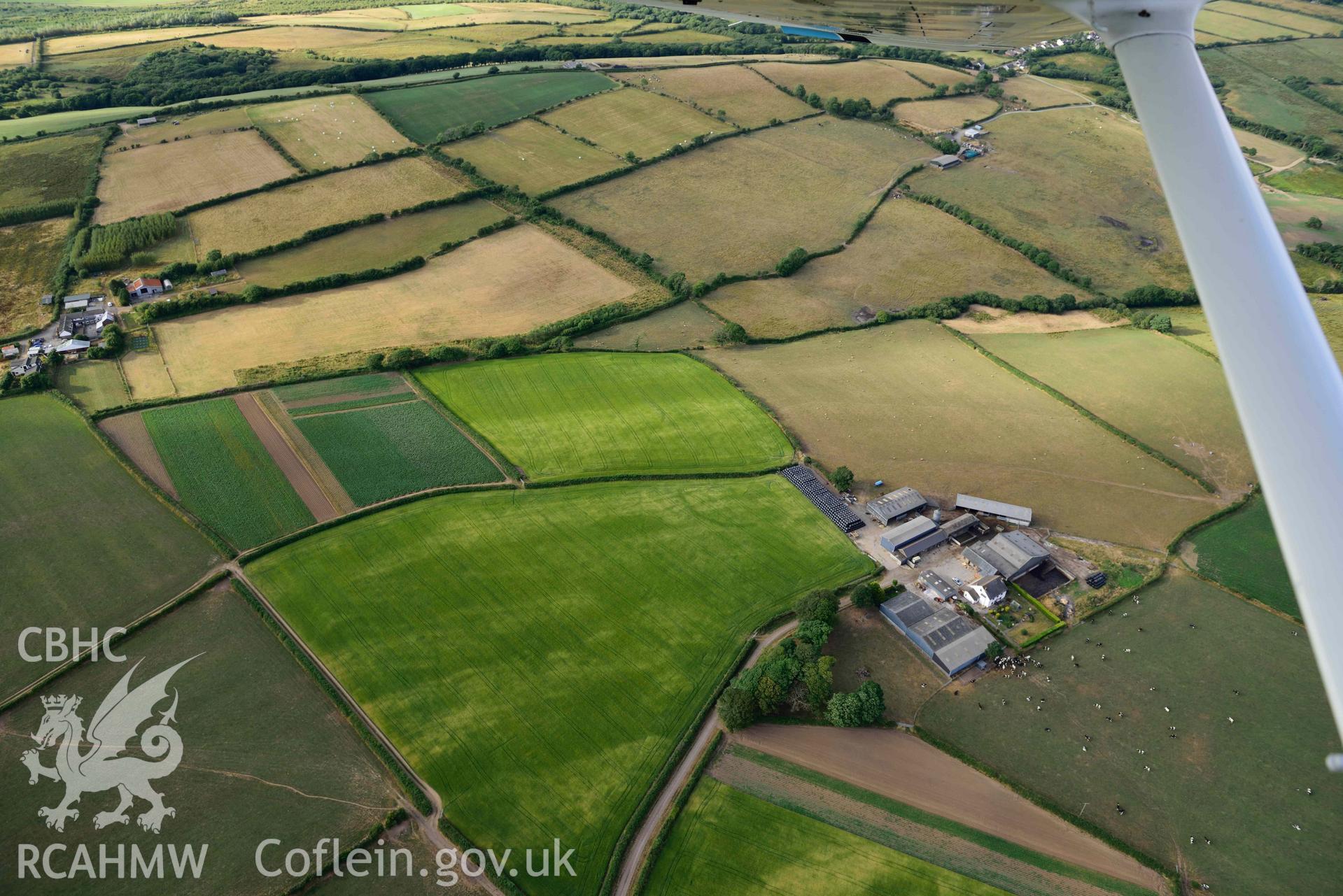 RCAHMW colour oblique aerial photograph of Parc Willis, cropmark of defended enclosure taken on 17 July 2018 by Toby Driver (NGR: SN470037)